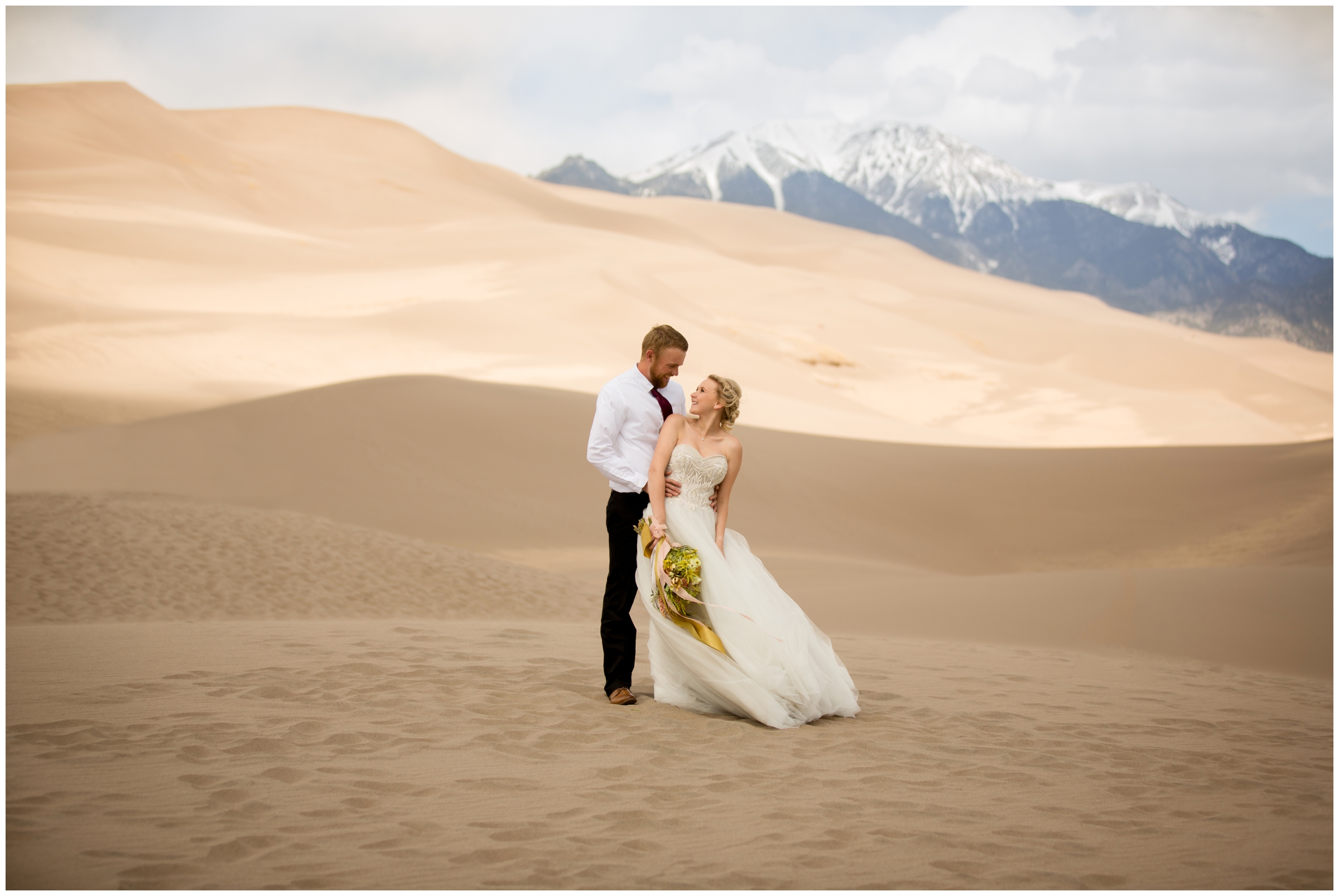 Colorado adventure elopement inspiration with sand dunes and mountains in background 
