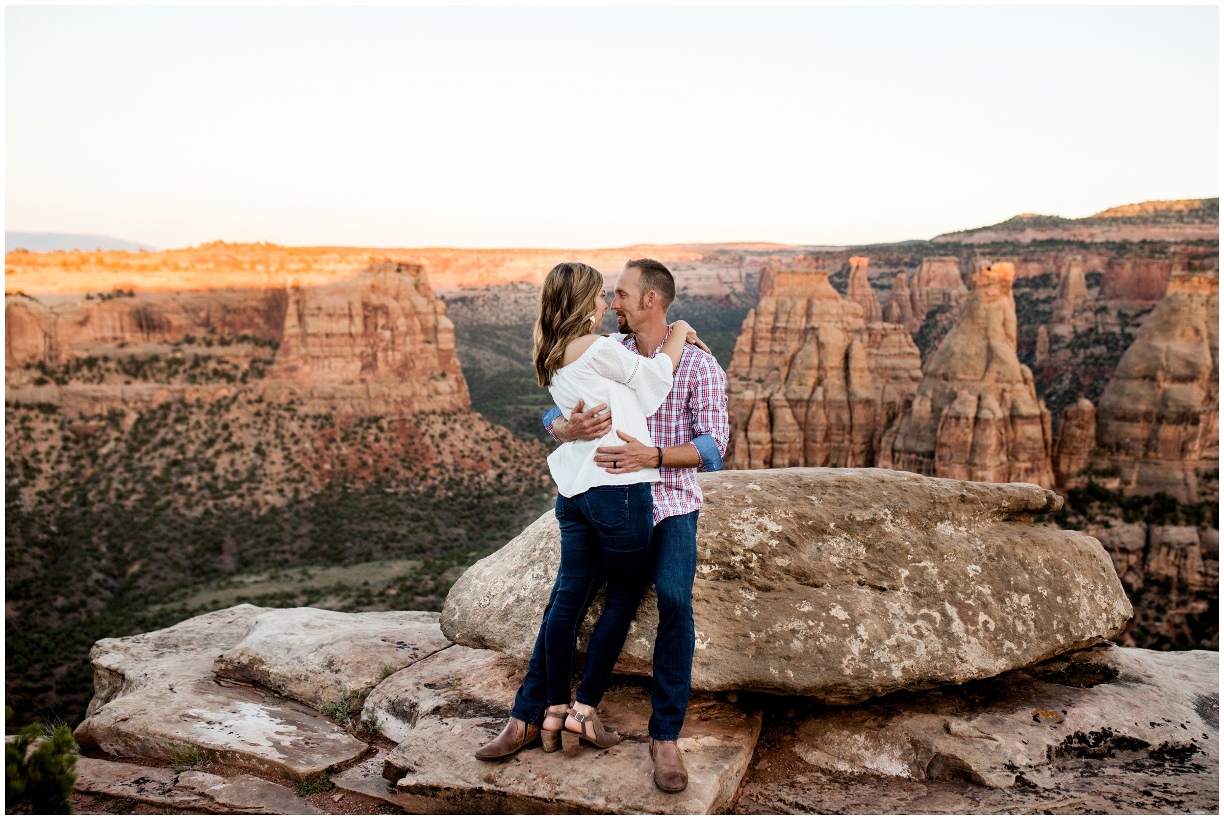couple cuddling during Grand Junction engagement portraits at Colorado National Monument 