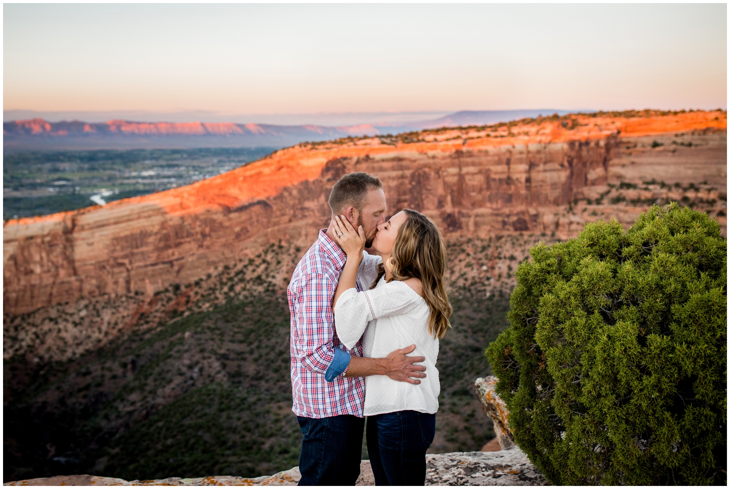 couple kissing on Colorado National Monument during Grand Junction mountain engagement photos