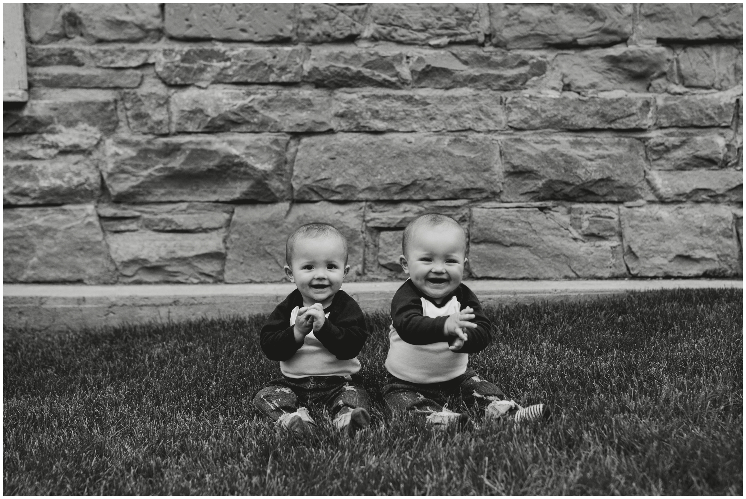 twin babies sitting in grass during Longmont Colorado family photos 