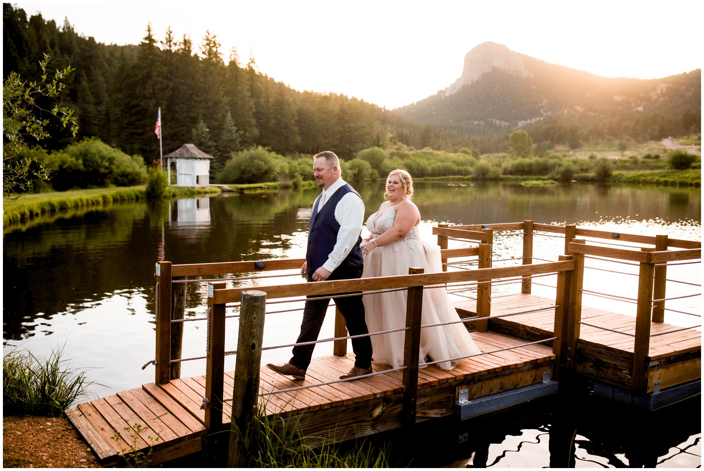 couple walking on dock during Colorado lake wedding portraits 