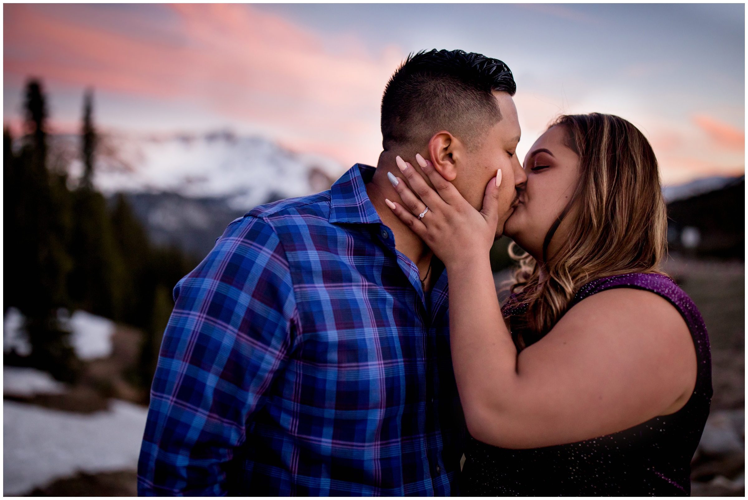 couple kissing on a mountain during Grand County Colorado engagement pictures 