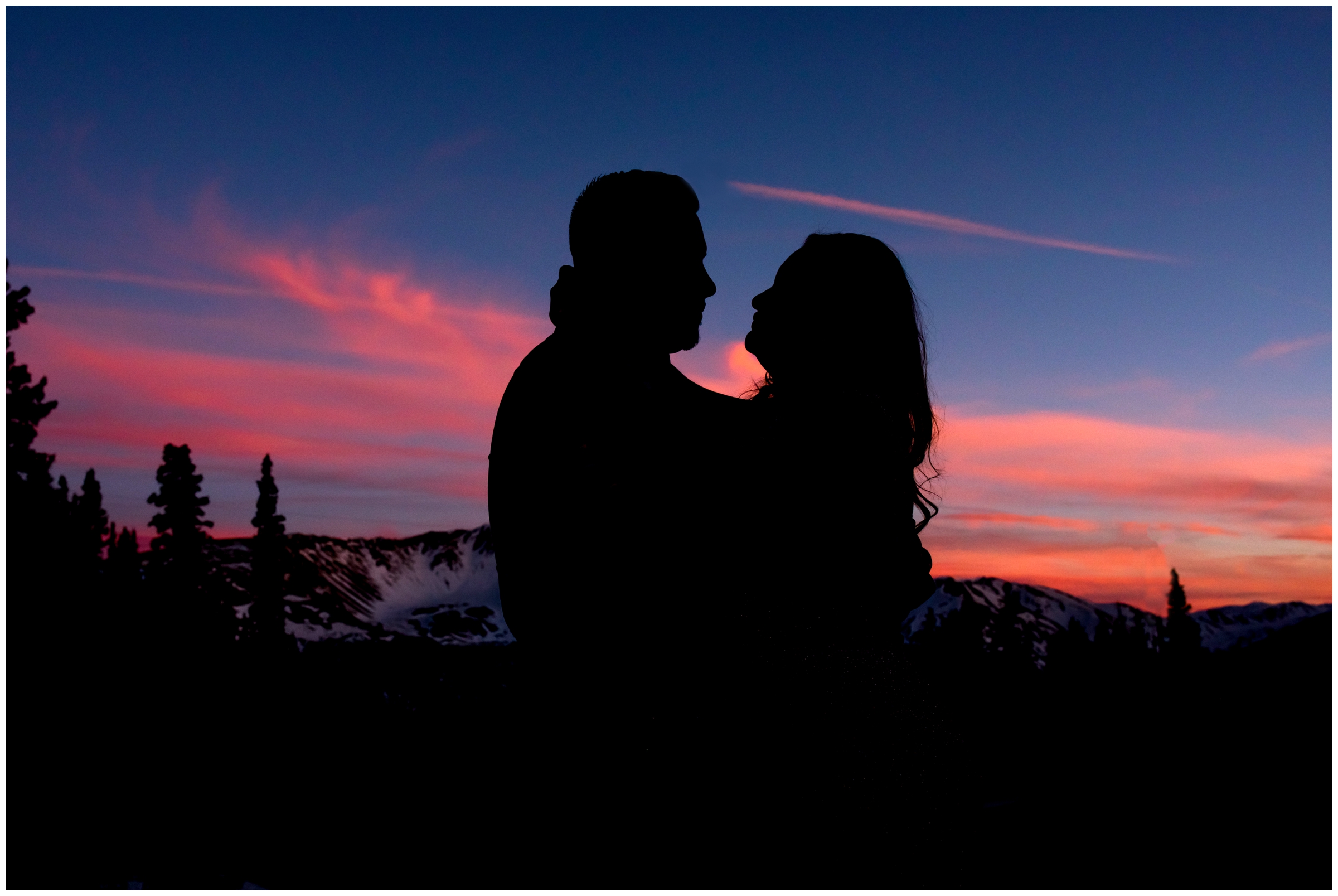 silhouette engagement photography during colorful Colorado sunset 