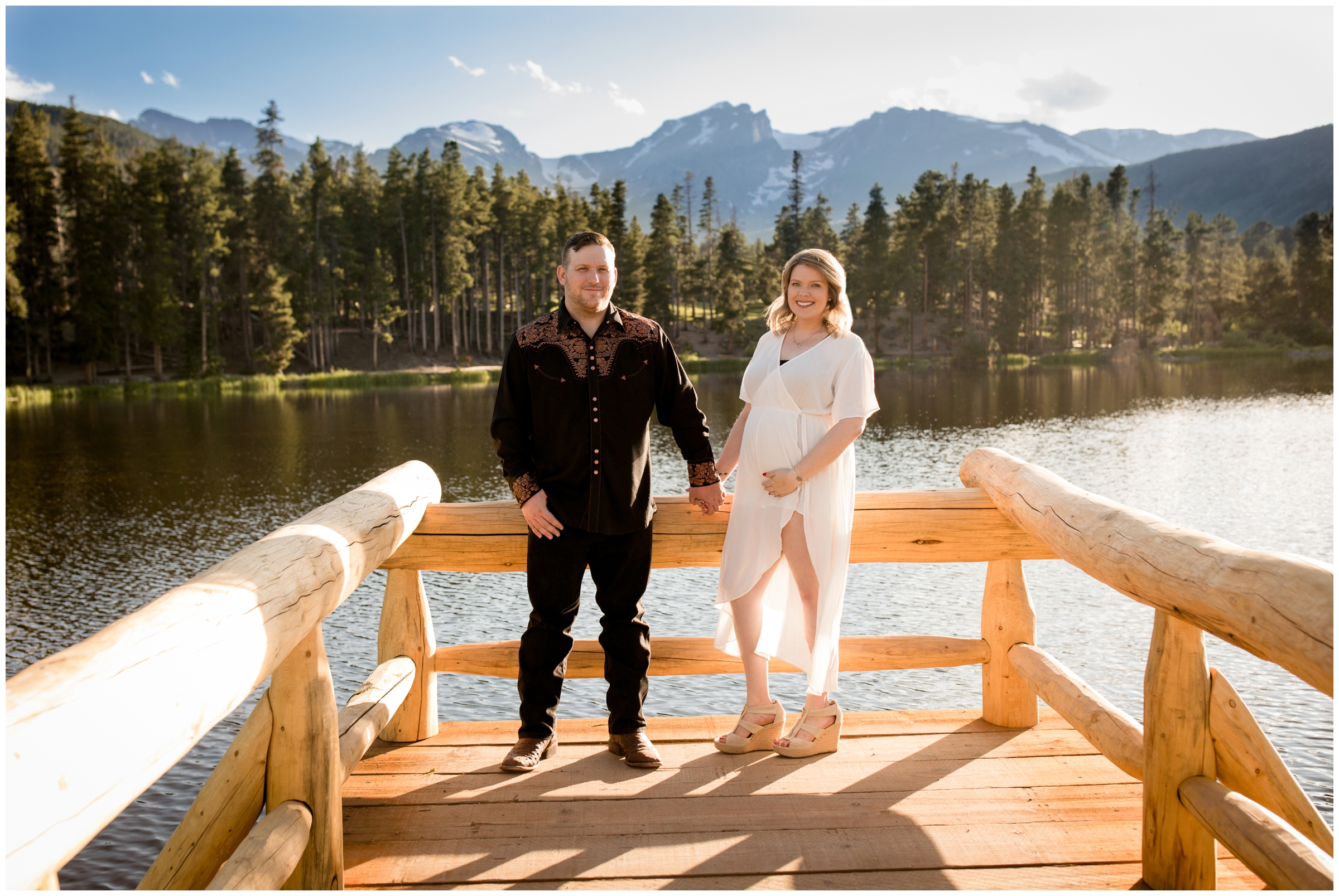 couple posing on dock at Colorado lake maternity photography session 