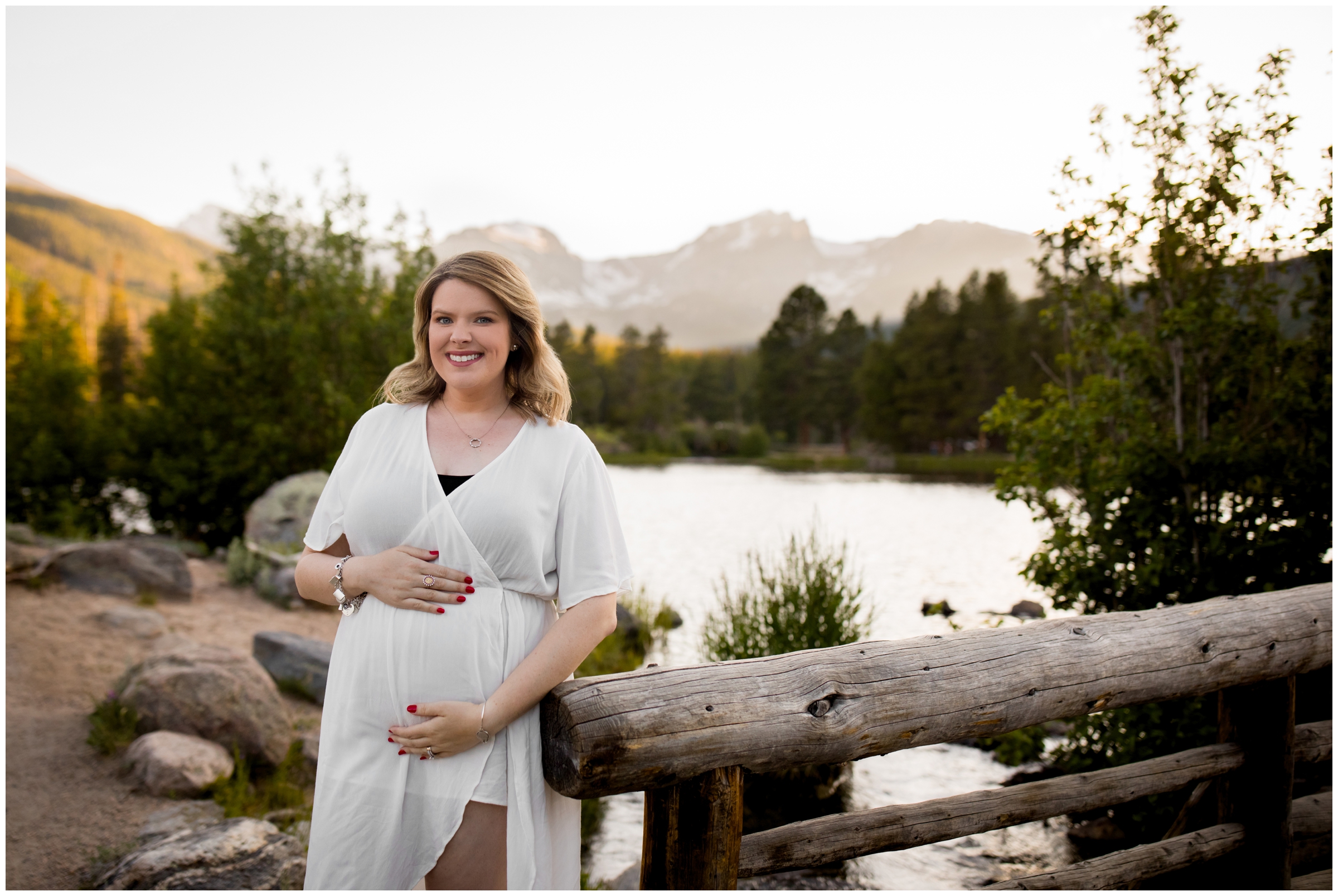 women leaning against bridge at Colorado mountain maternity pictures 
