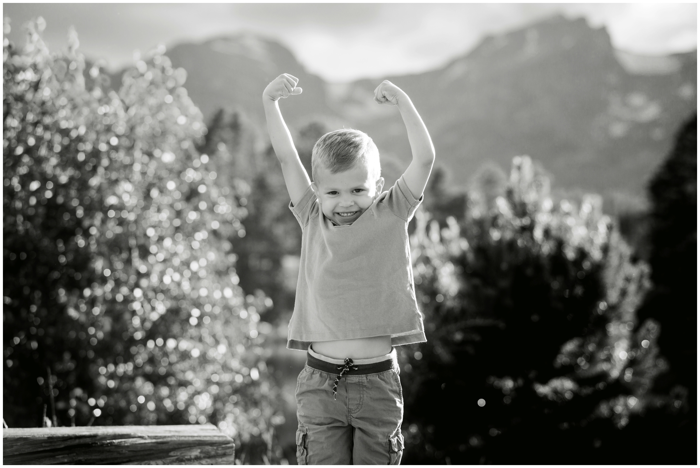 little boy flexing muscles during Colorado child photography 