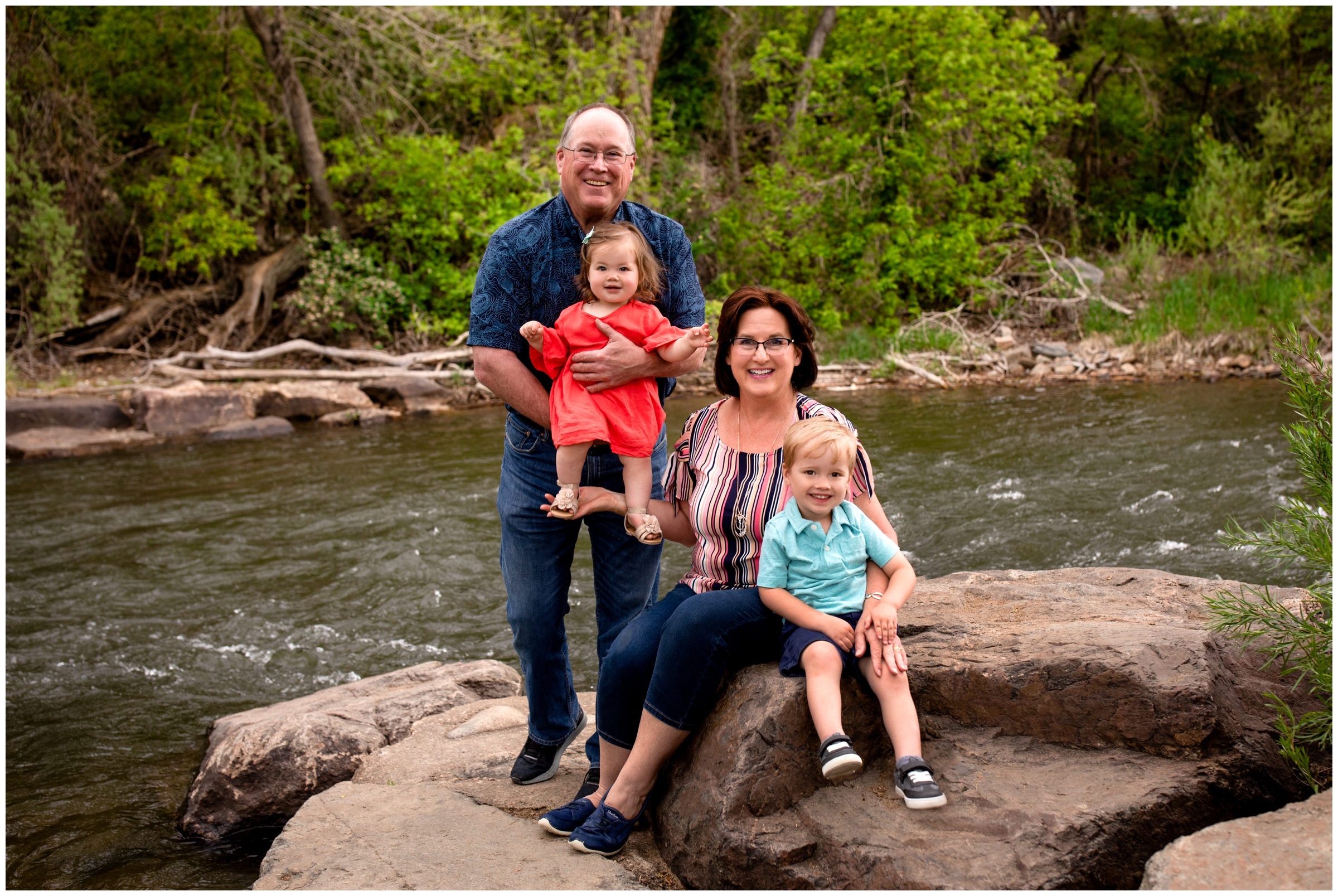 grandparents and grandkids posing by the river during Colorado family portraits 