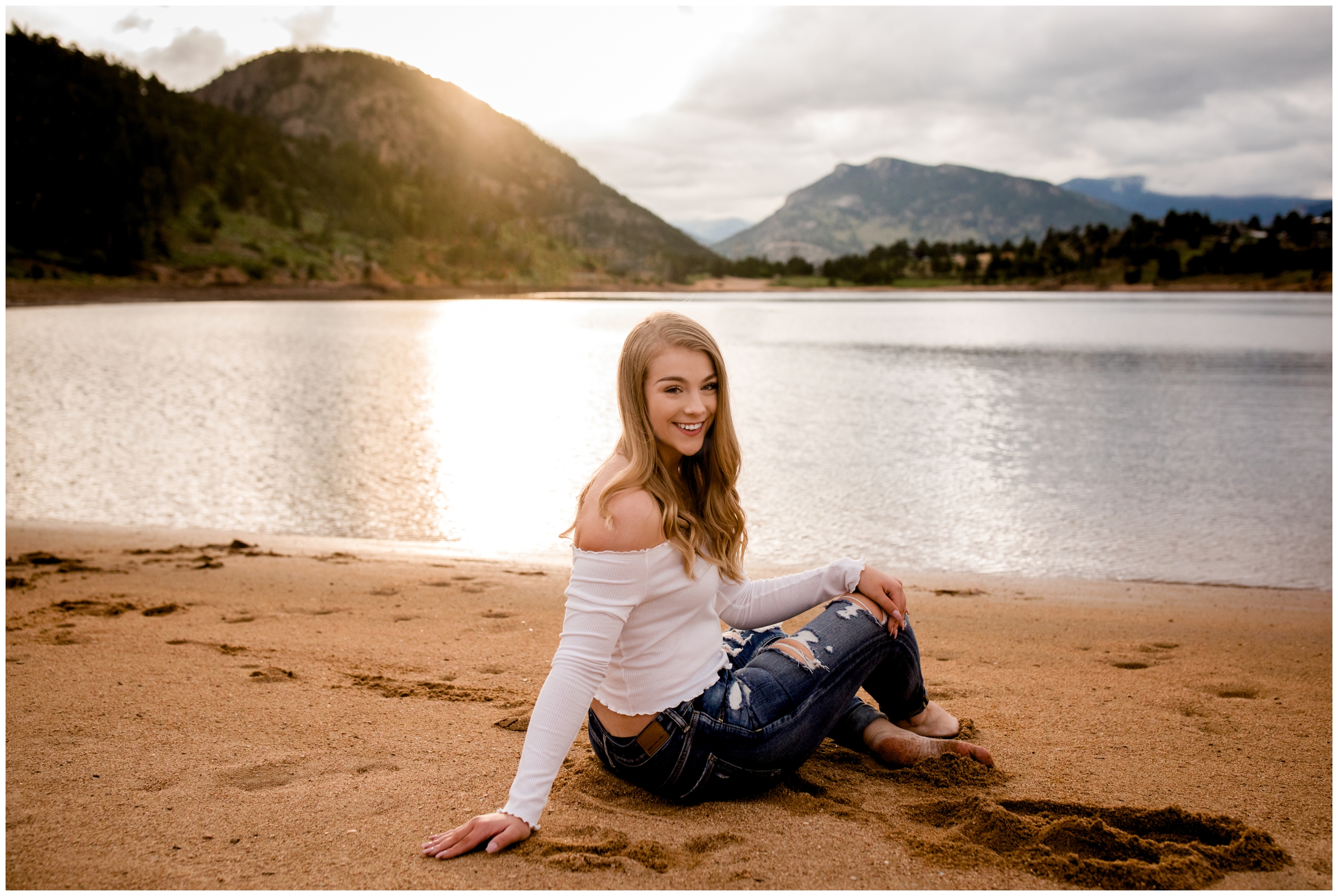 teen girl posing in the sand during Colorado lake senior pictures at Mary's Lake Estes Park 