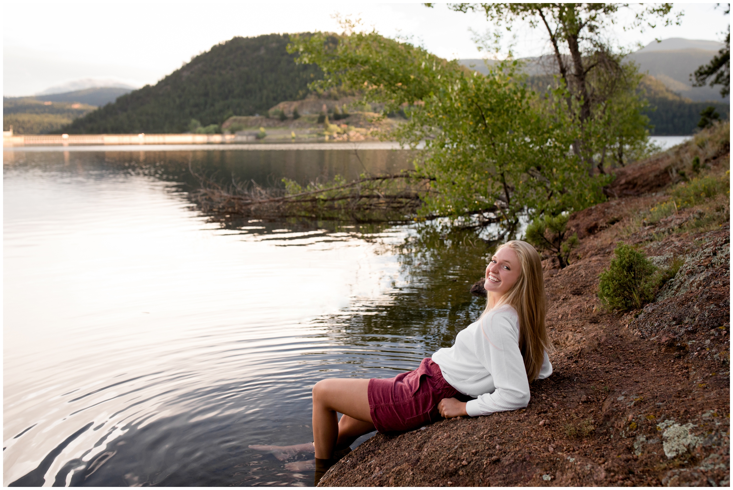 teen girl wading in water of gross reservoir 