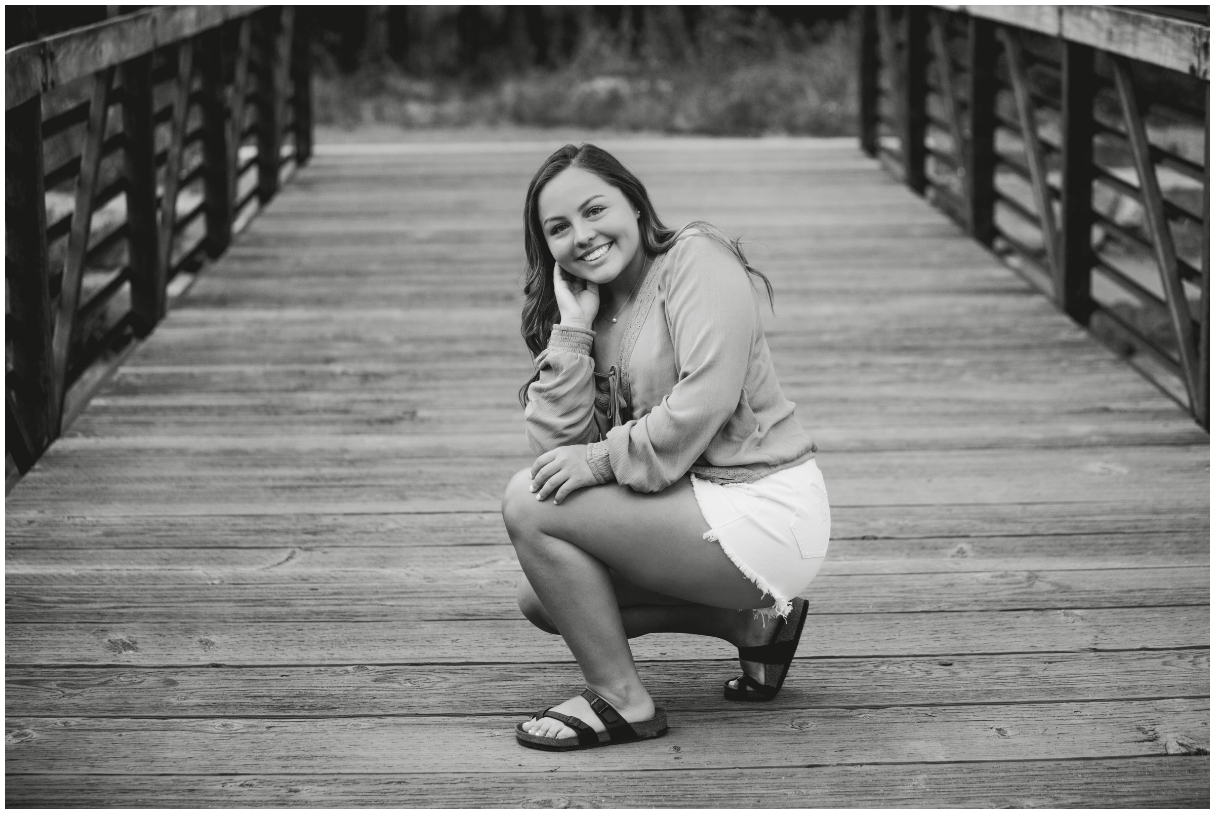 teen posing on bridge at Lavern Johnson Park during Lyons Colorado senior pictures 