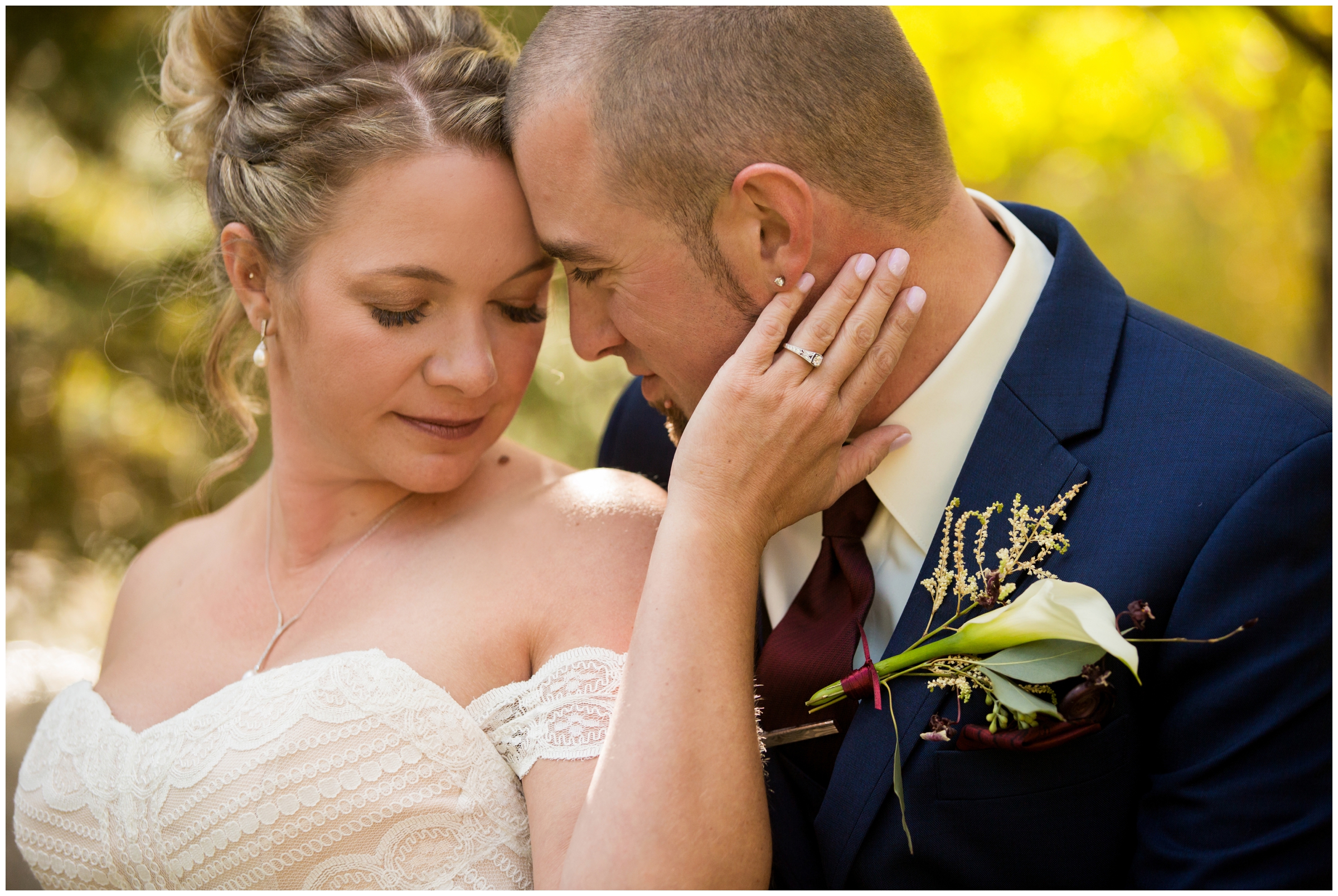 bride and groom embracing during romantic Estes Park Colorado wedding photos 