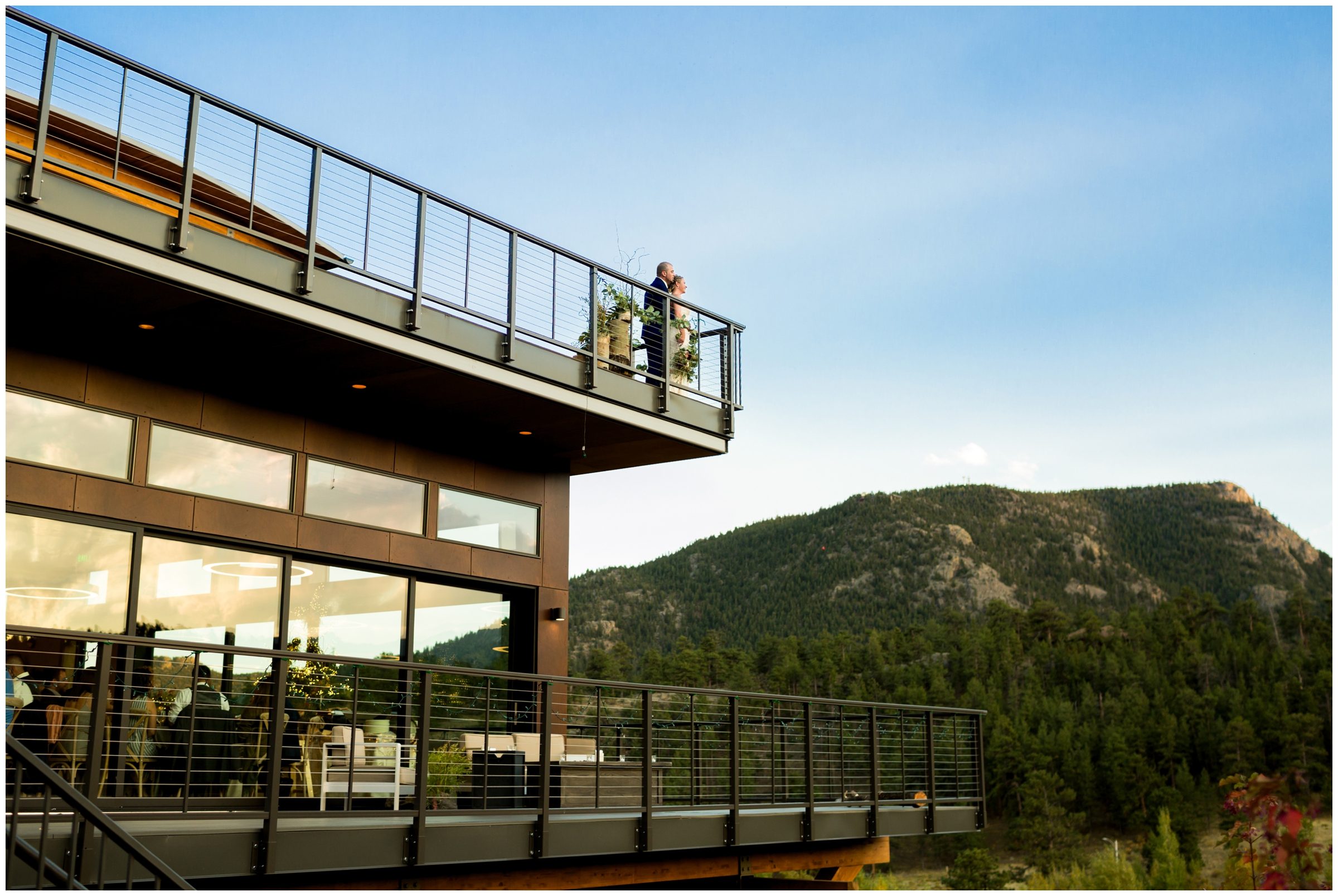 couple standing on deck at Skyview Fall River Village wedding in Estes Park 