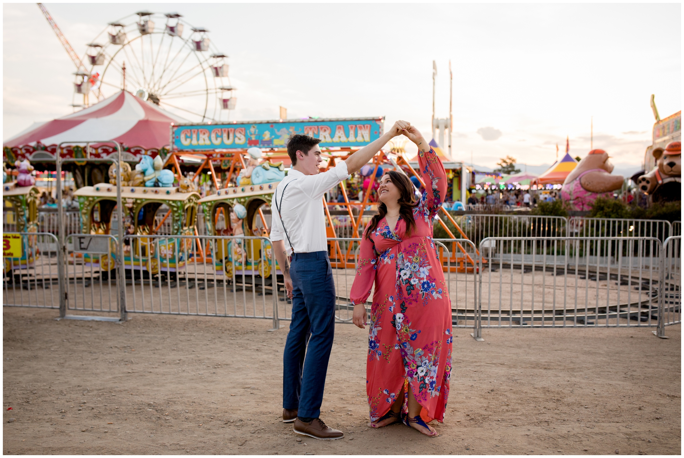 couple dancing at the county fair during Colorado engagement pictures