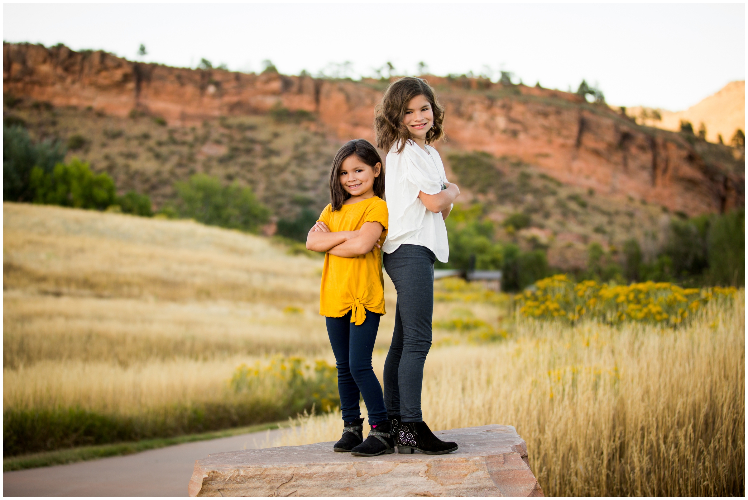 girls posing with red rock formations in background at Colorado summer photography session 