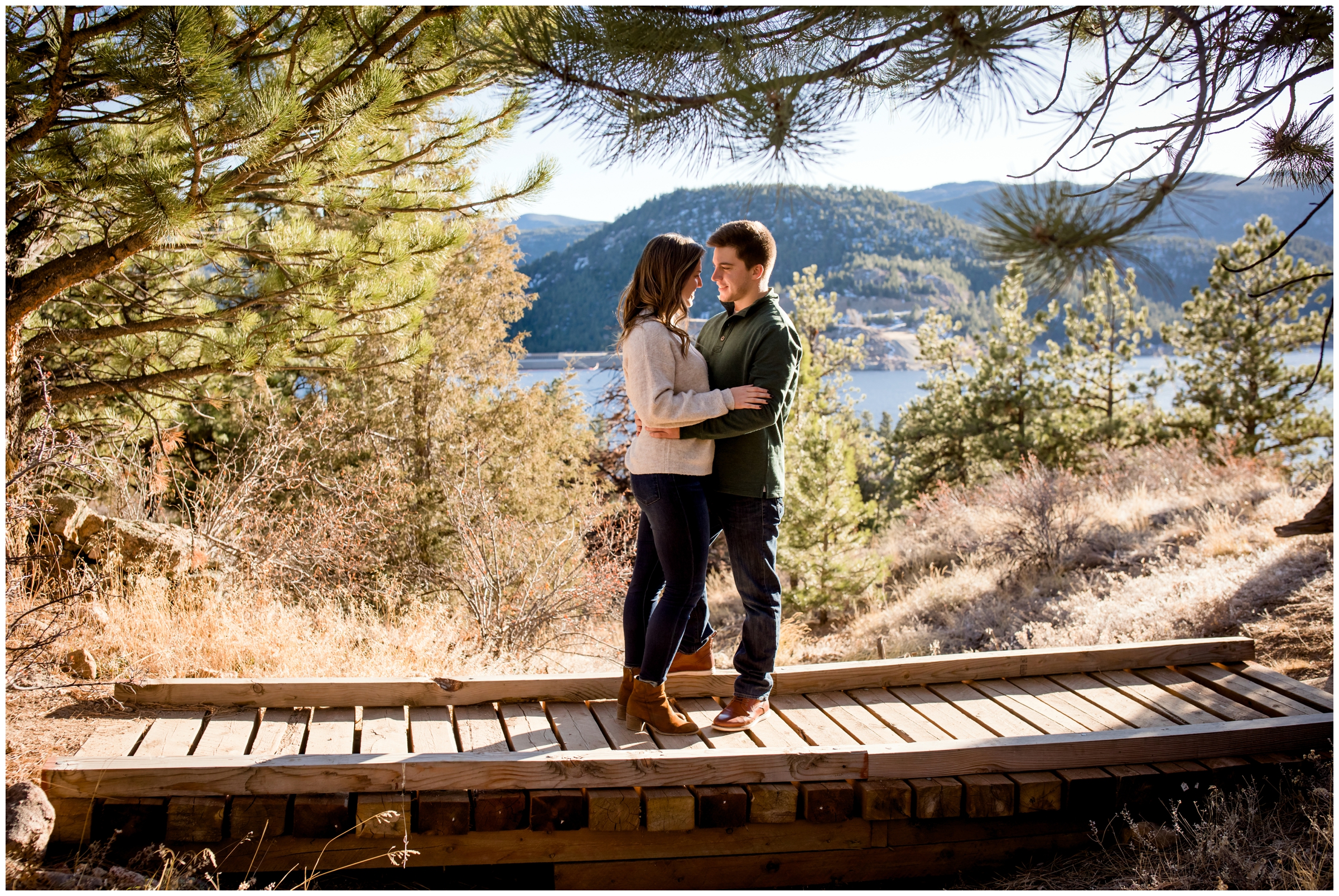 couple posing on a bridge at Gross Reservoir Colorado 