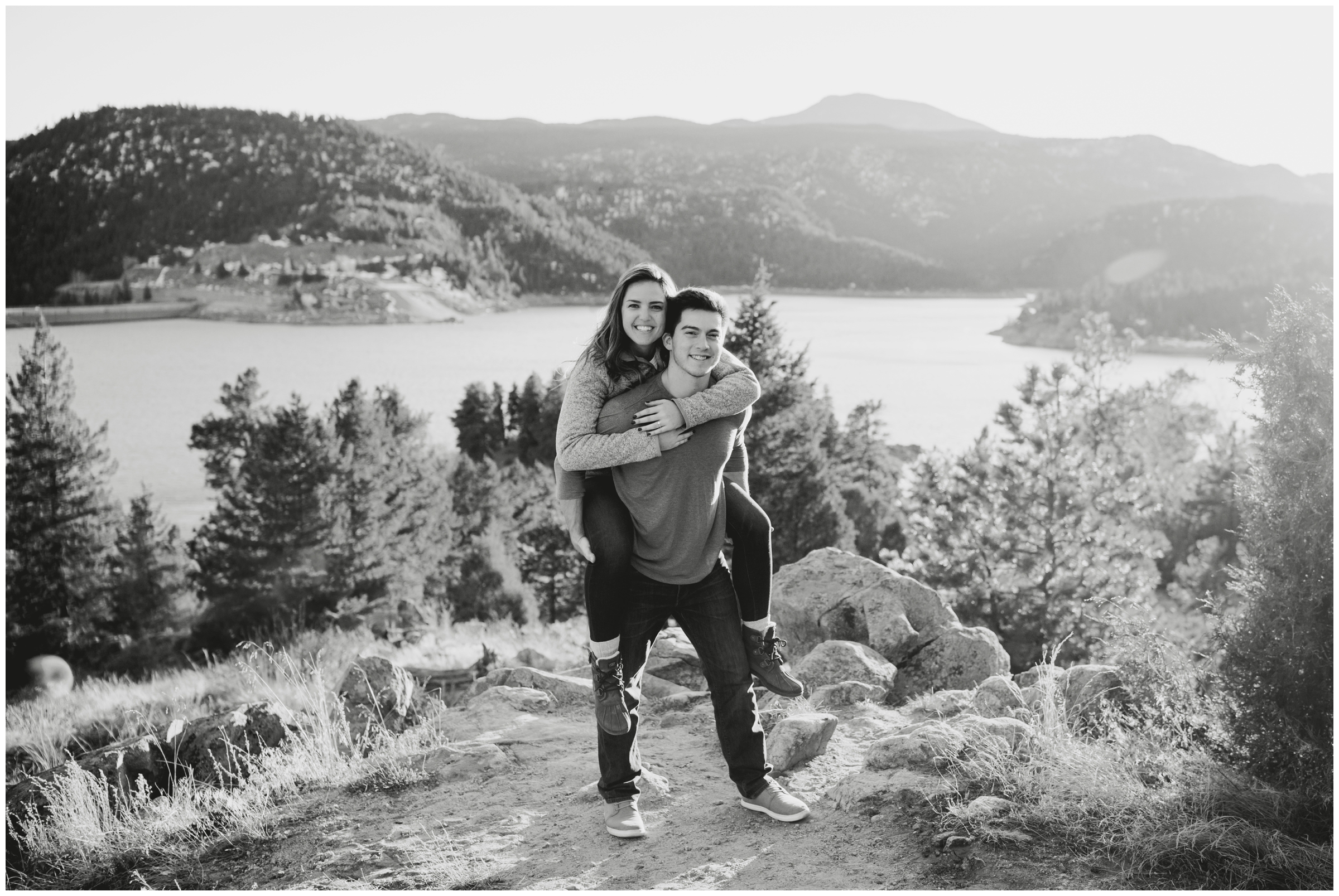 guy giving fiancé a piggyback ride during their Boulder Colorado mountain engagement photos 