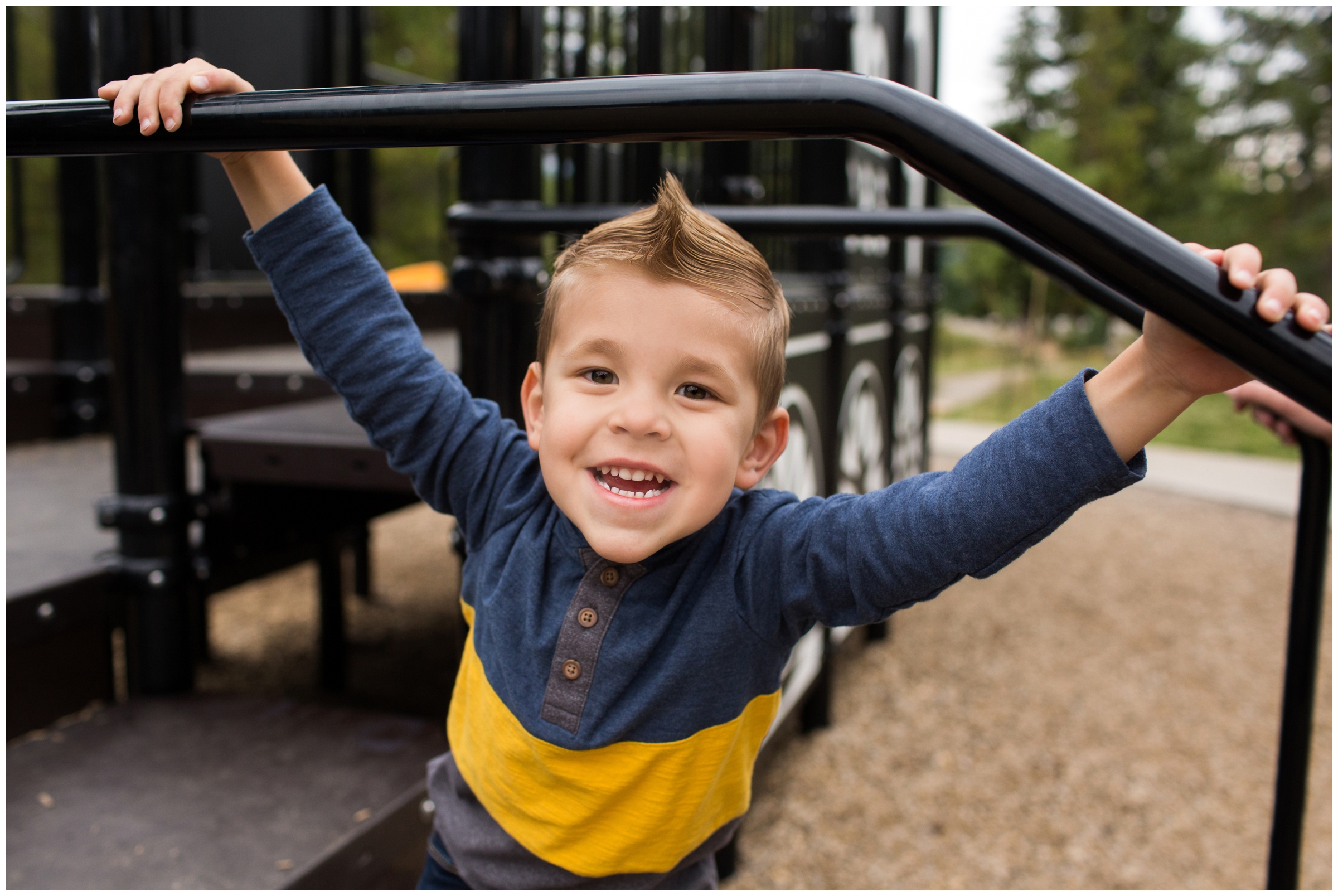 boy swinging on playground at High Line Railroad Park Breckenridge 