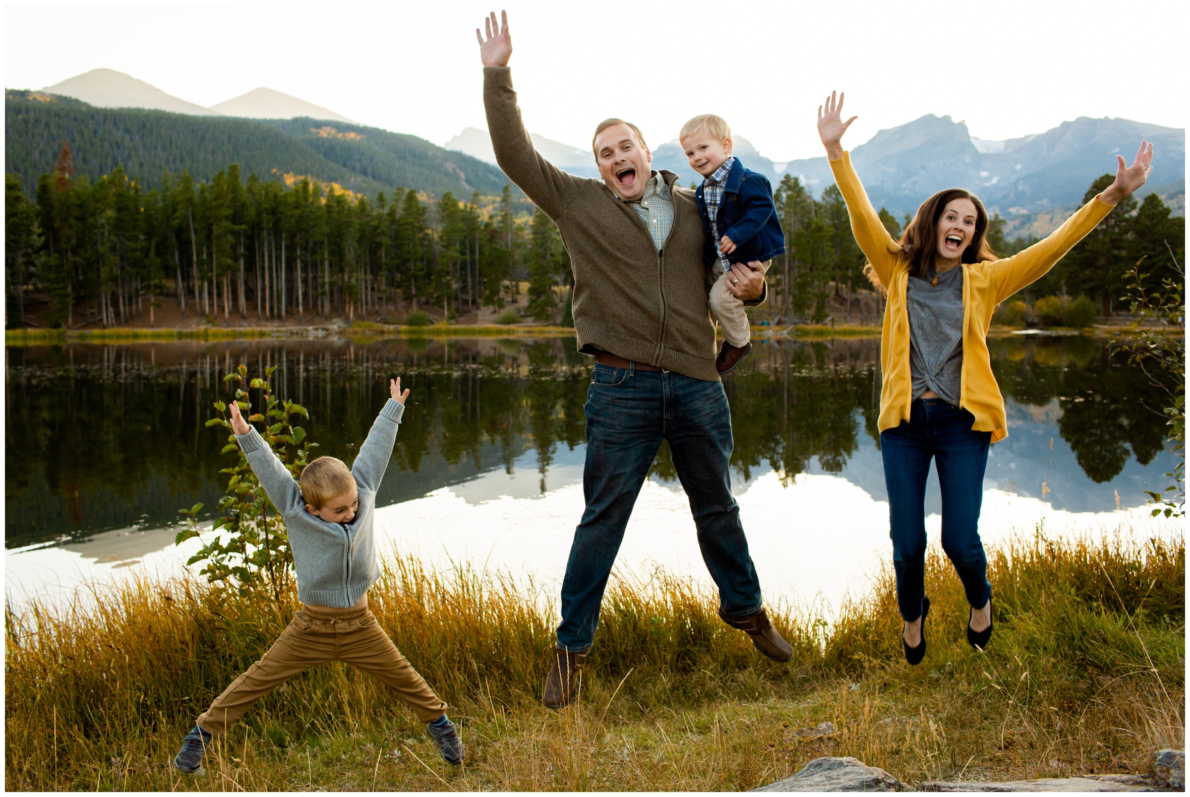 family jumping in front of Sprague Lake during RMNP Estes Park family photography session 