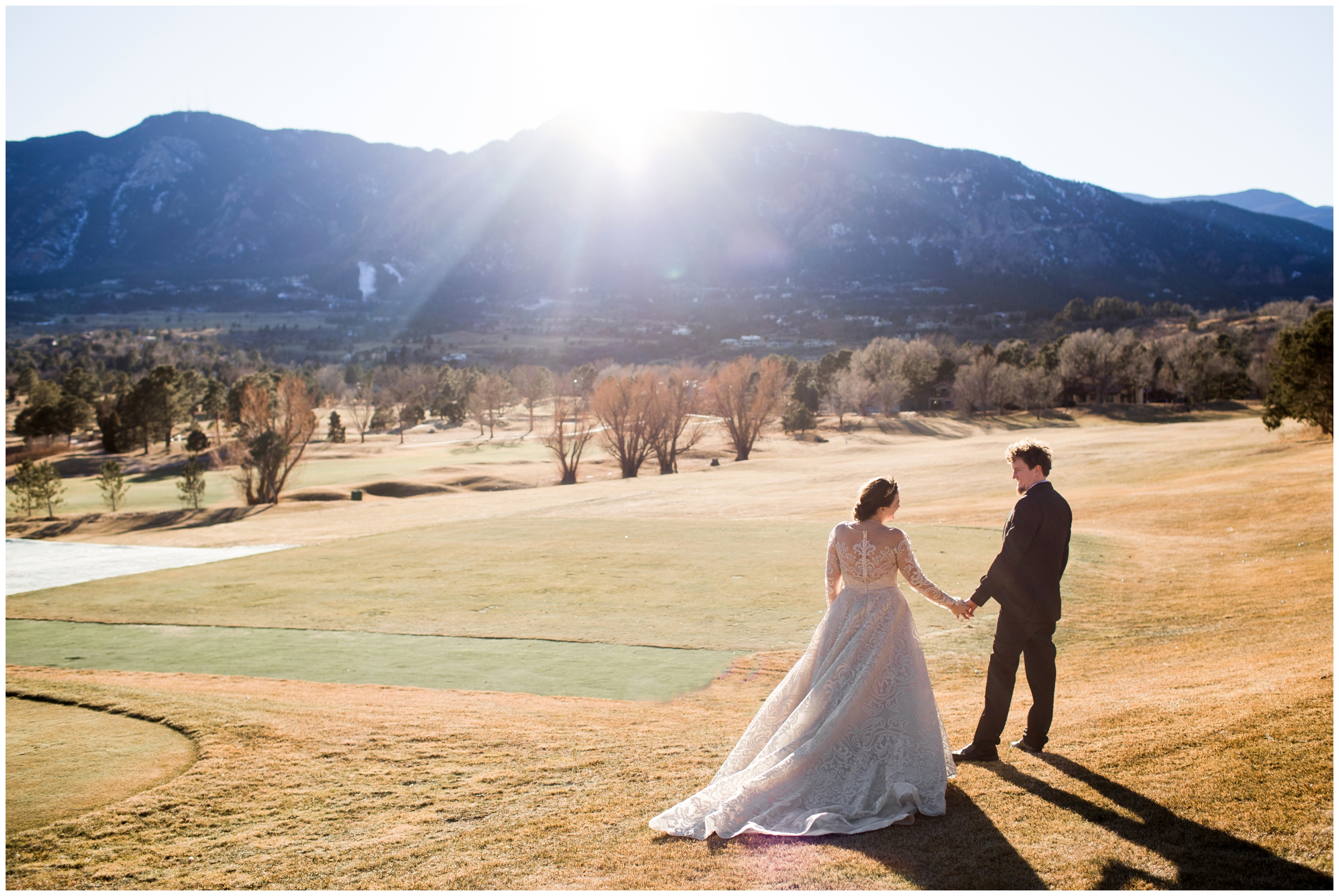 couple posing on golf course during winter wedding at Cheyenne mountain resort