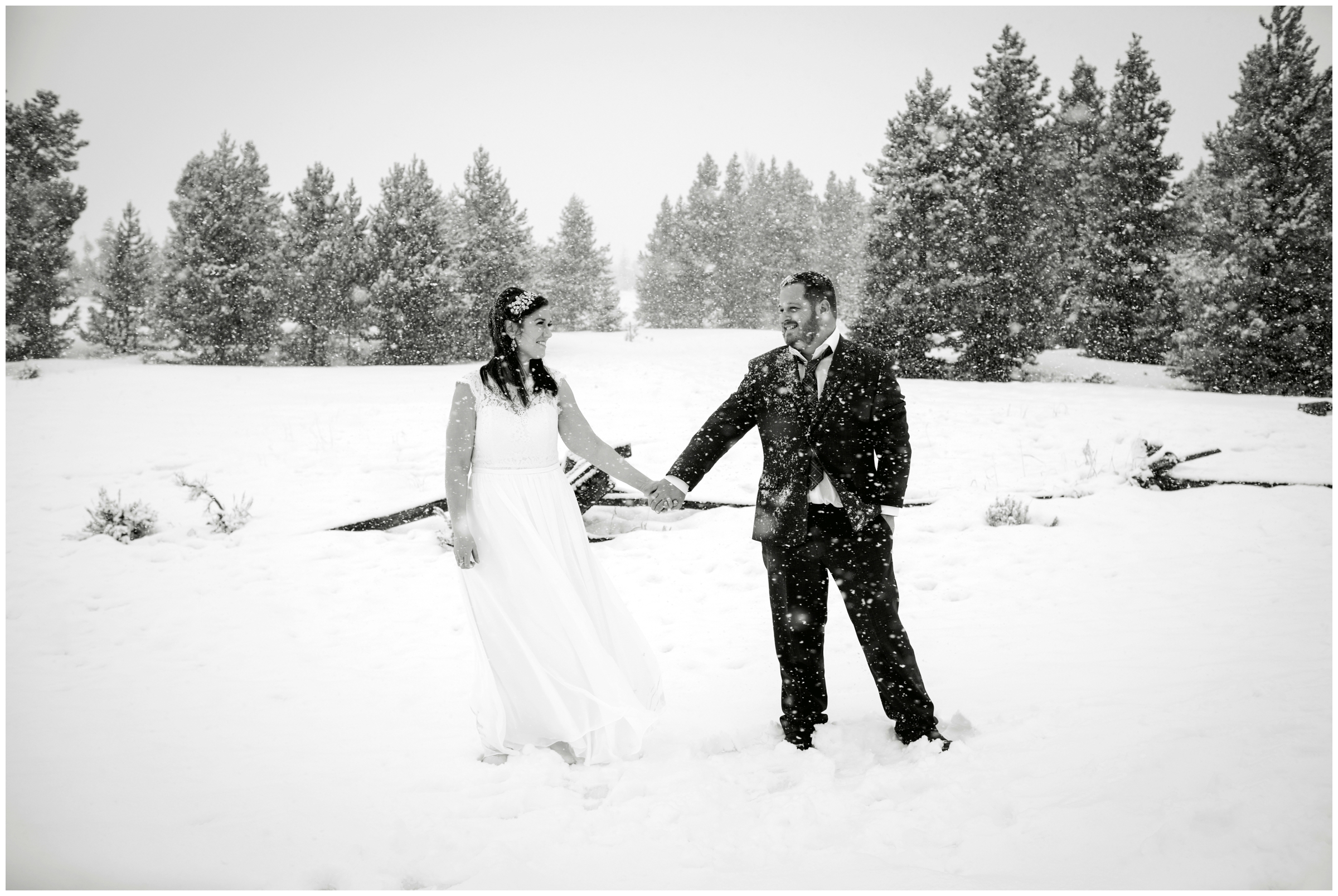 couple posing in the snow during Breckenridge Colorado winter wedding pictures 