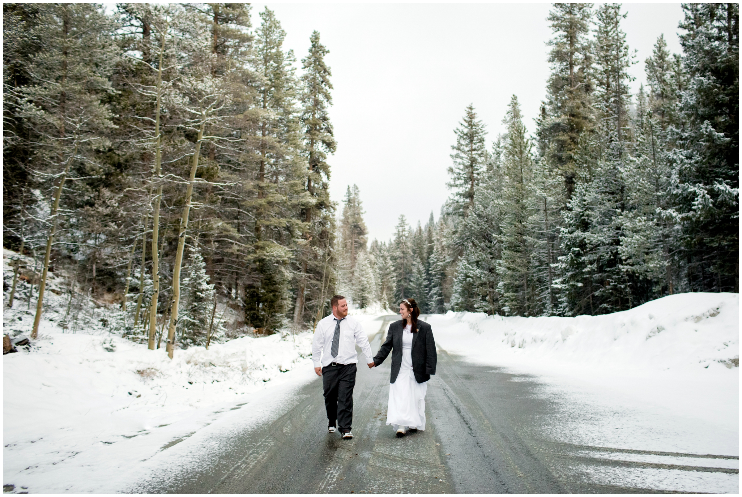 couple walking down snowy road during Idaho Springs winter wedding by Colorado photographer Plum Pretty Photography 