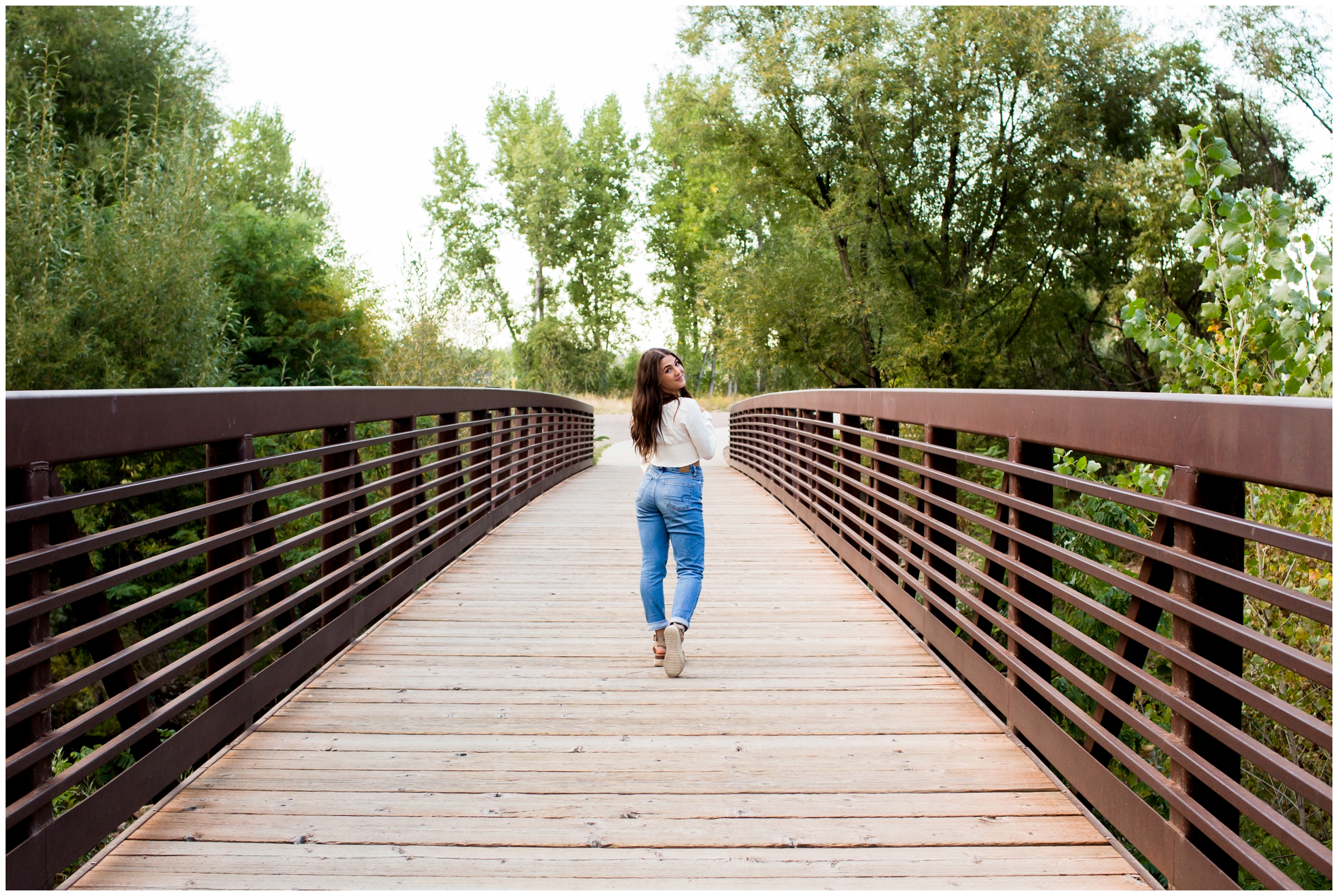 teen walking on bridge at Golden Ponds Longmont 