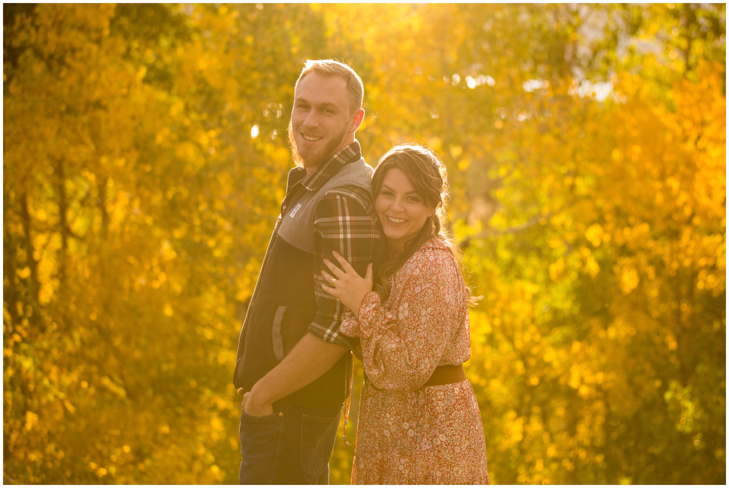 couple posing in colorful aspen grove during Breckenridge engagement photography session by Plum Pretty Photo 