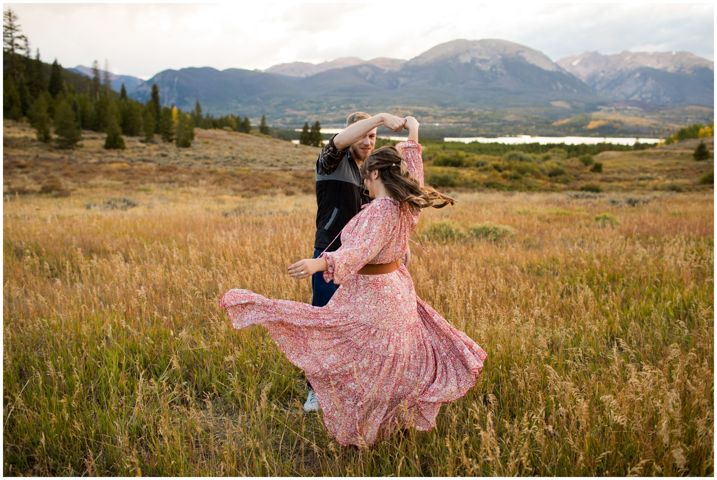 woman spinning in flowy dress during Colorado mountain engagement photos by Breckenridge photographer Plum Pretty Photography 