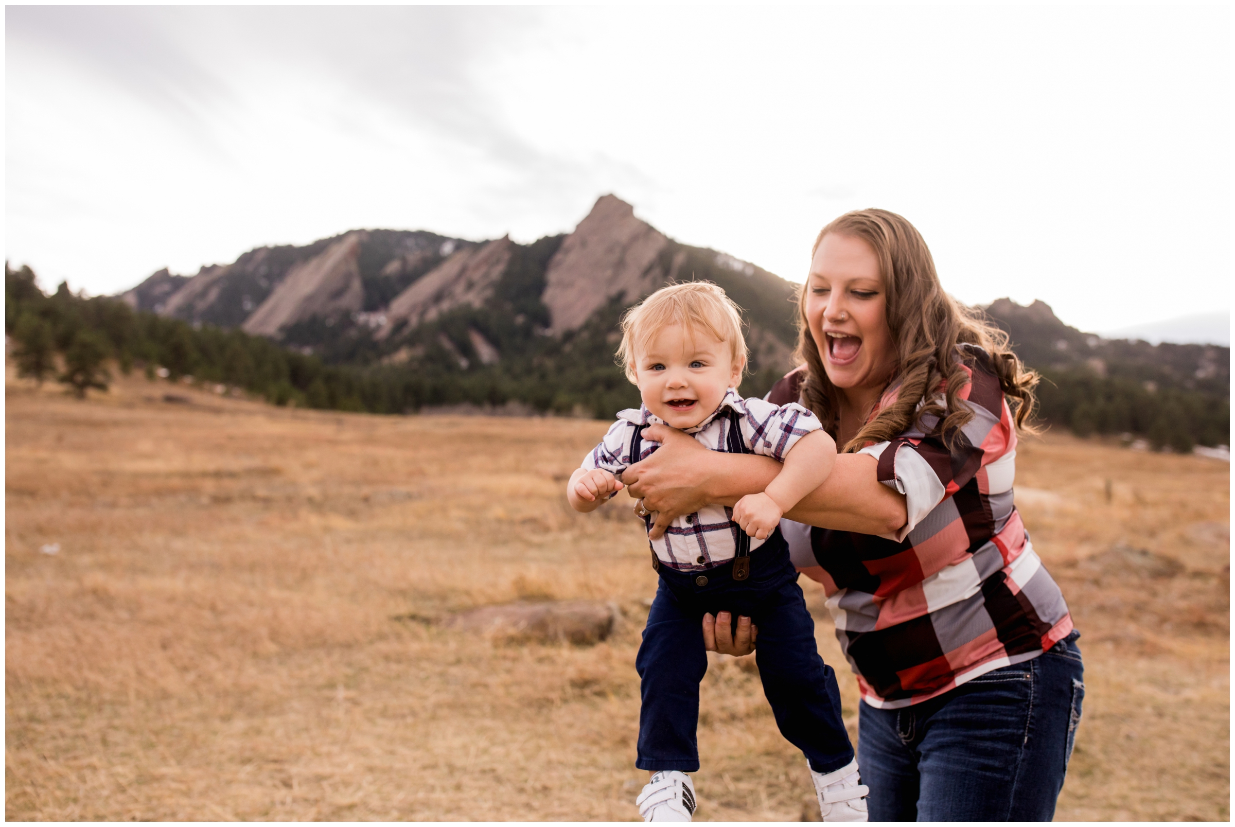 mom holding toddler during Boulder family pictures at Chautauqua 