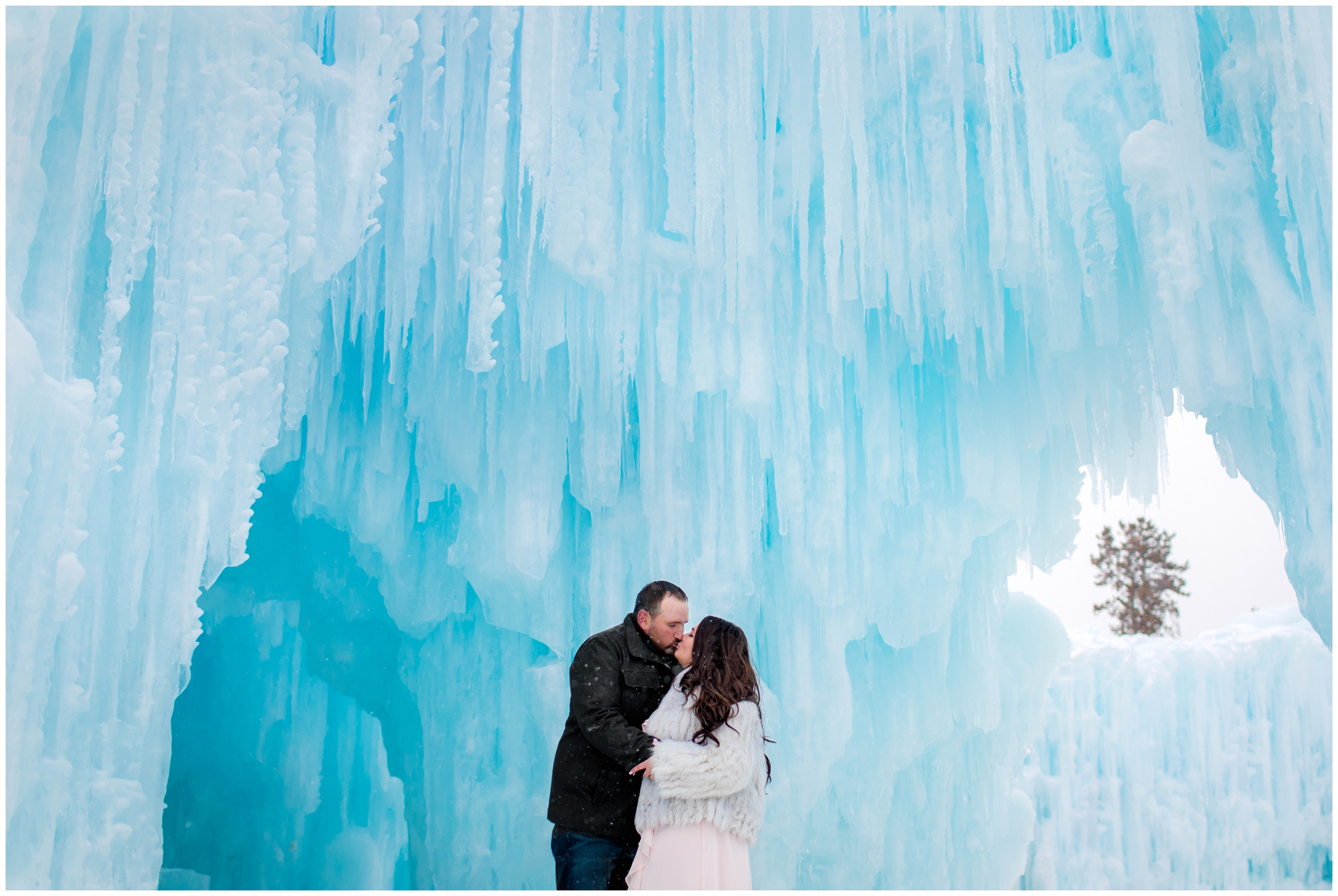 couple kissing in the Dillon Ice castles by Breckenridge photographer Plum Pretty Photography