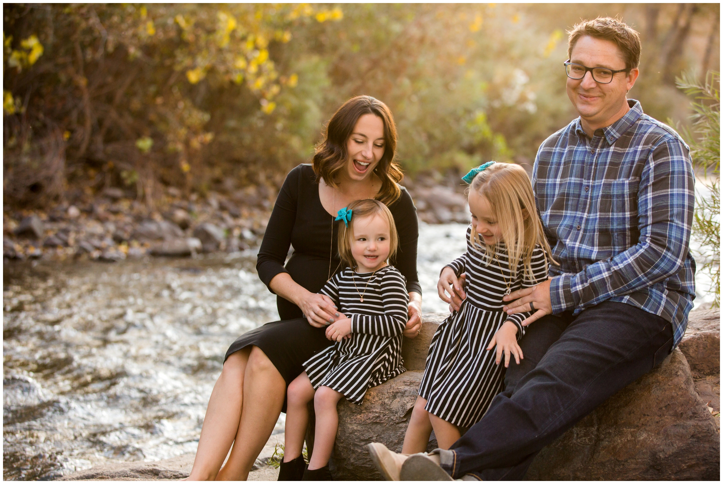 family playing by the river during Colorado fall family photography session 