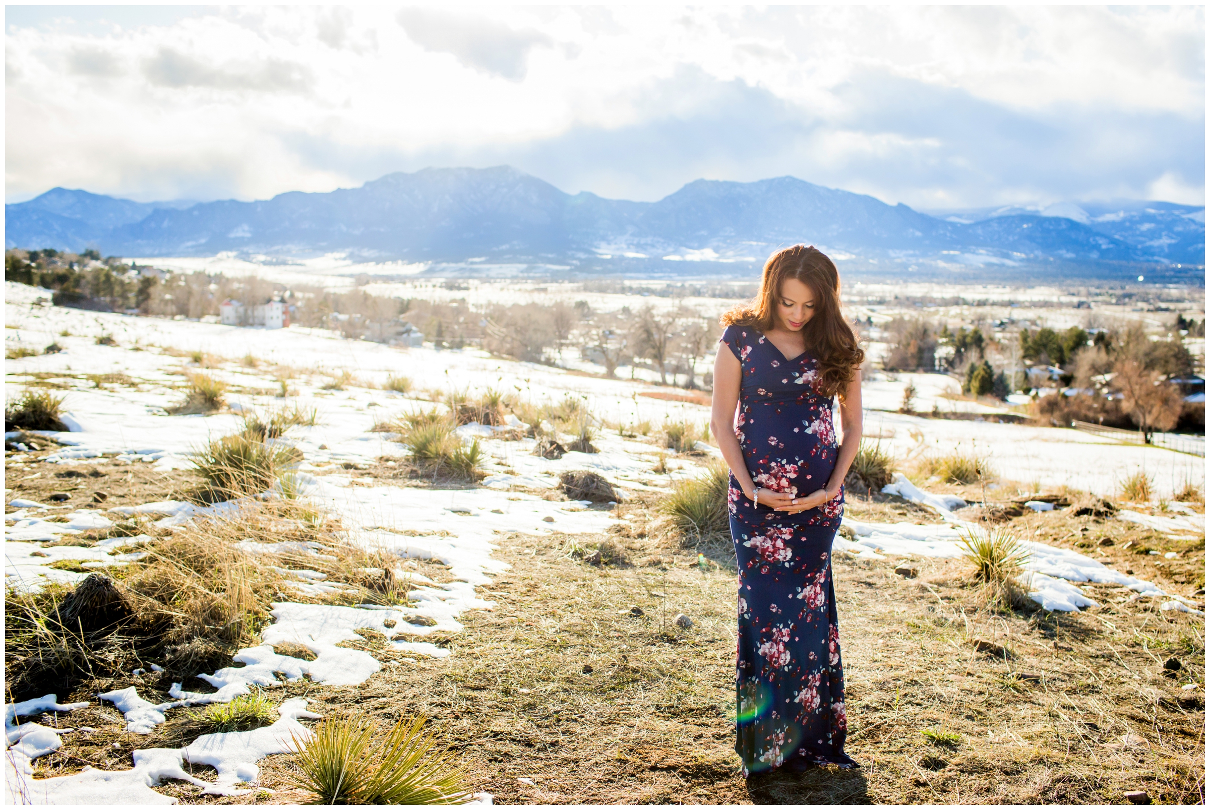 woman in long floral maternity dress during Colorado pregnancy portraits in Boulder