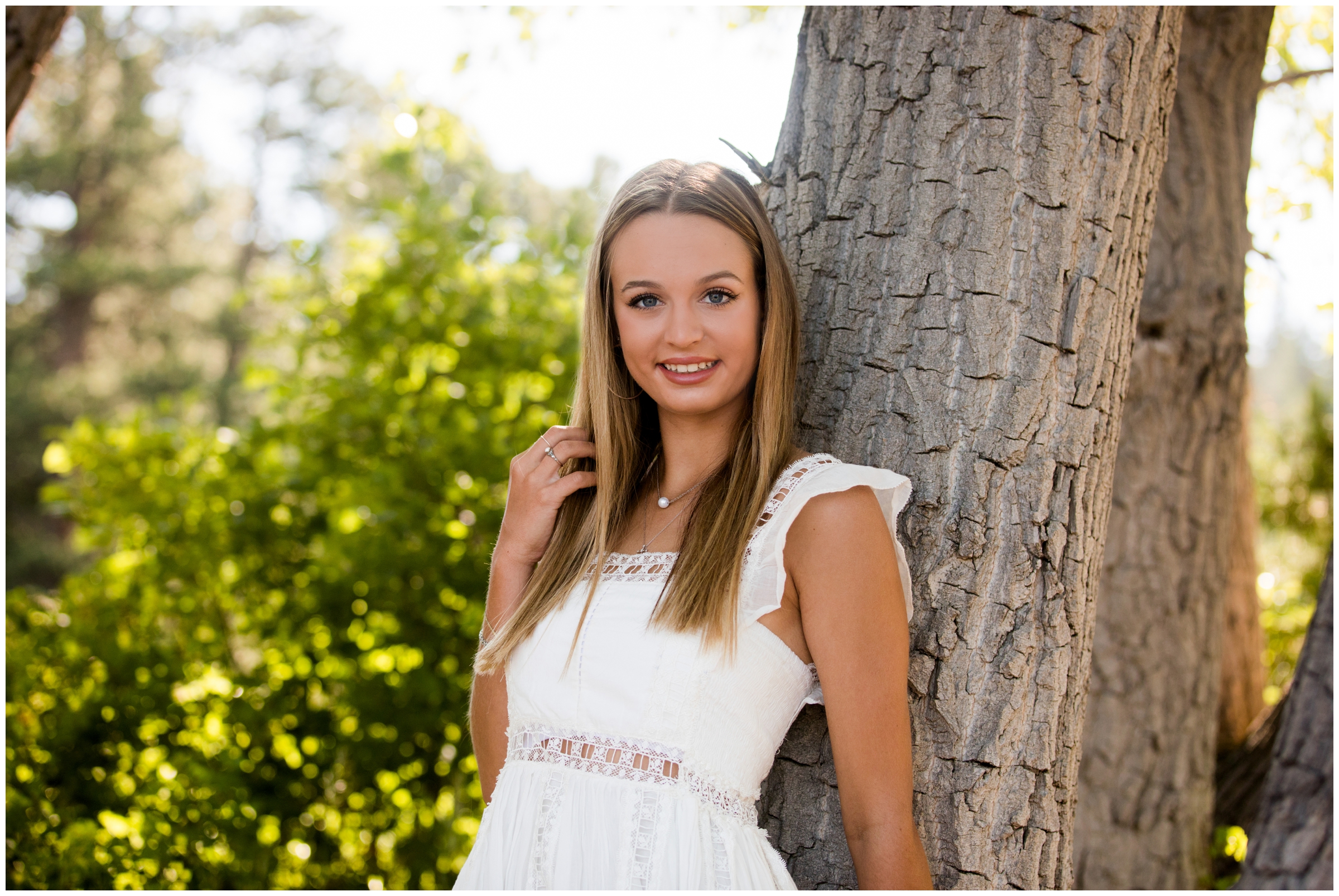 teen leaning against tree during CO portrait session