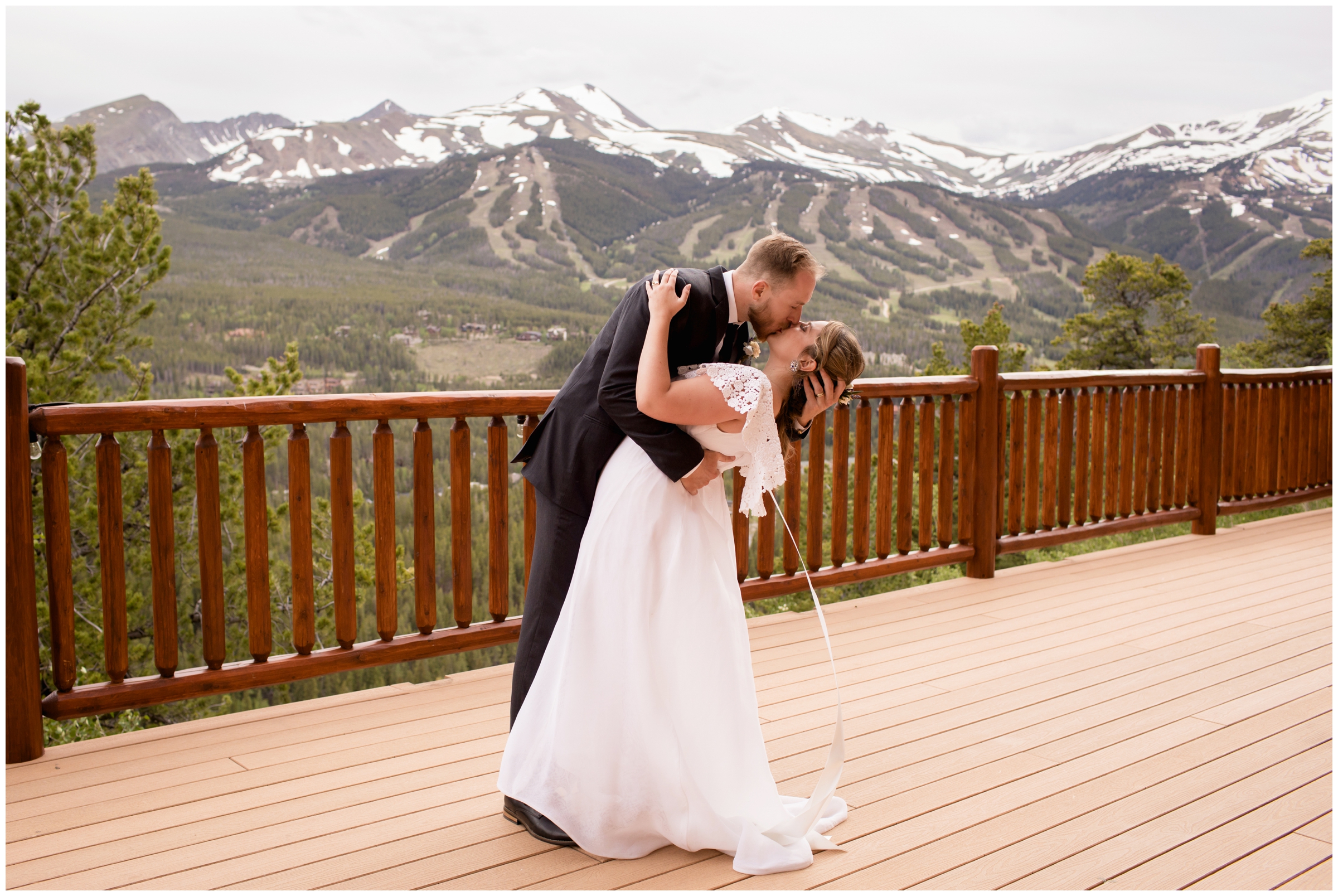 groom dipping bride on deck during the Lodge at Breckenridge wedding photos by Breckenridge Colorado photographer Plum Pretty Photography