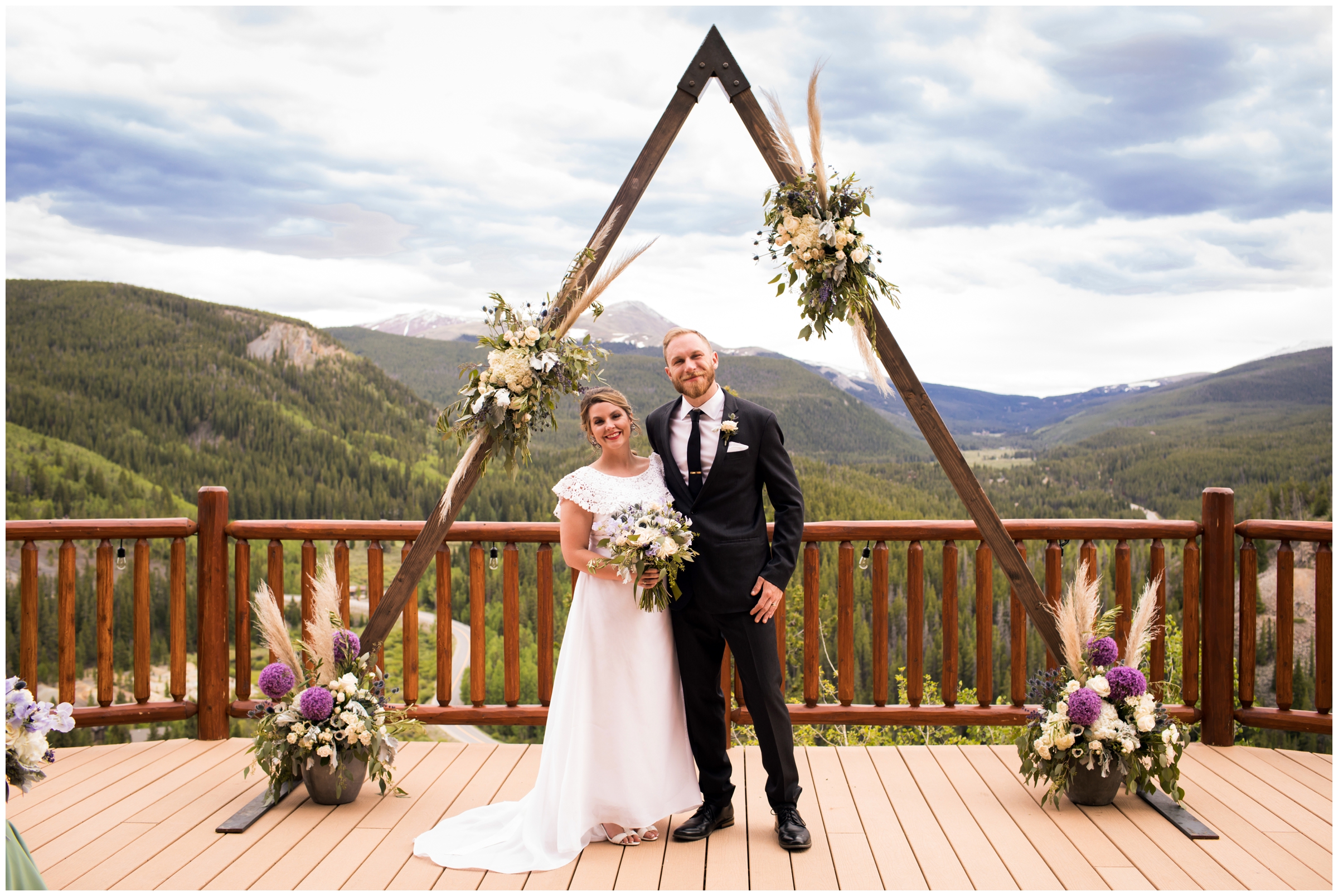 bride and groom posing in front of triangle arch at the lodge at breckenridge colorado summer wedding 