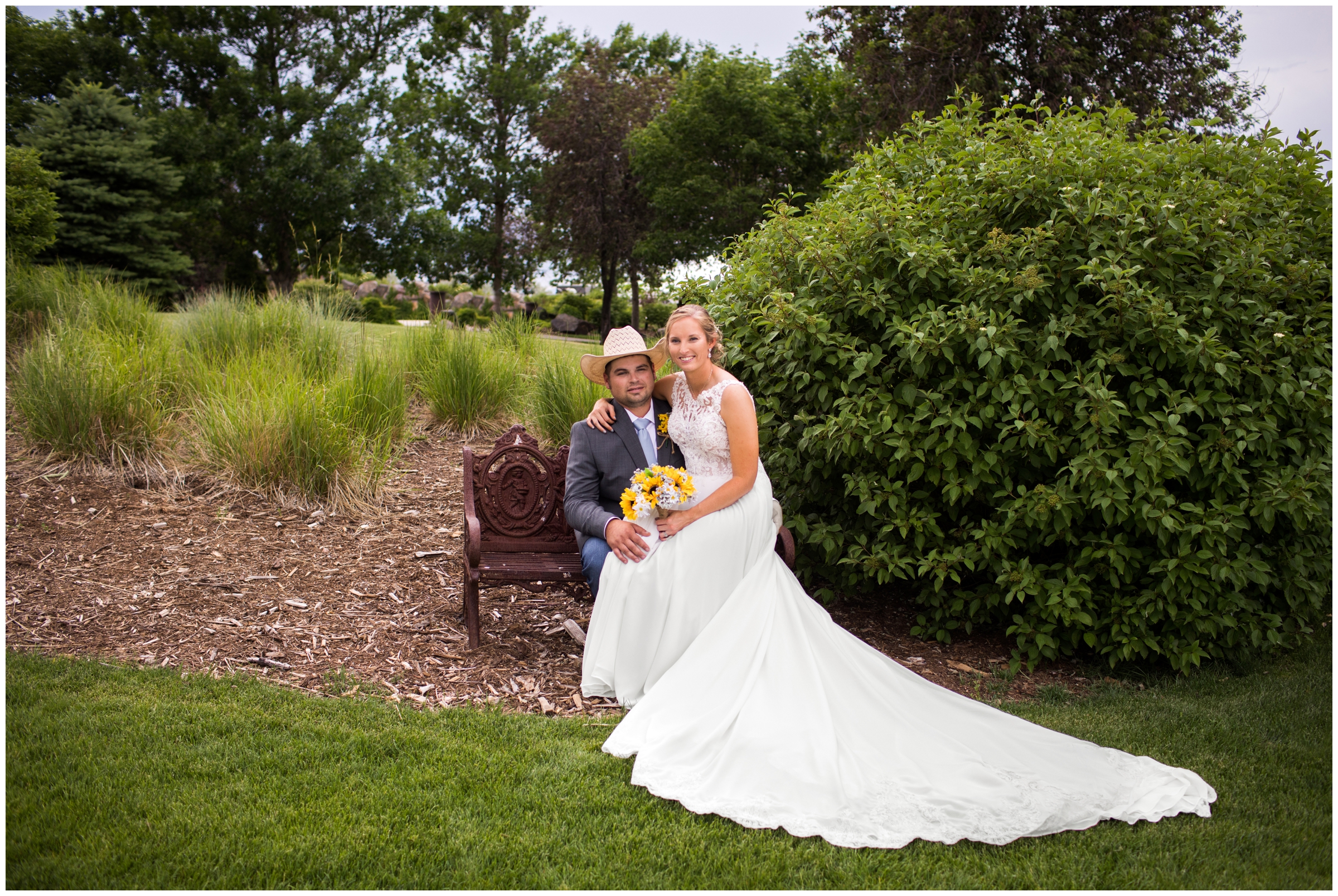couple cuddling on bench during Pelican Lakes wedding pictures in Windsor Colorado 