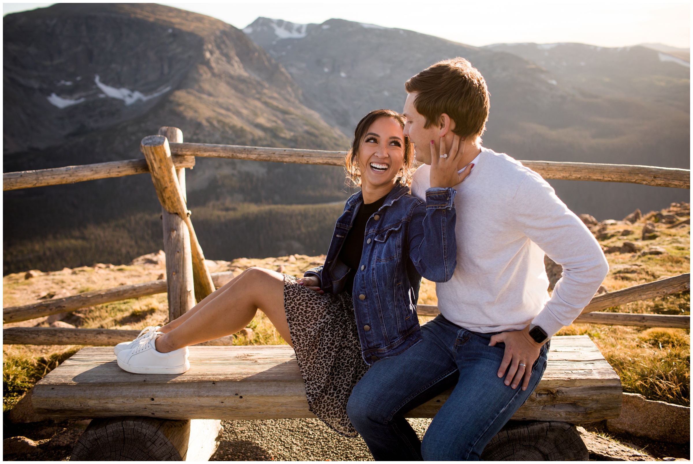 couple sitting on a bench on trail ridge road during Colorado mountain engagement photography session