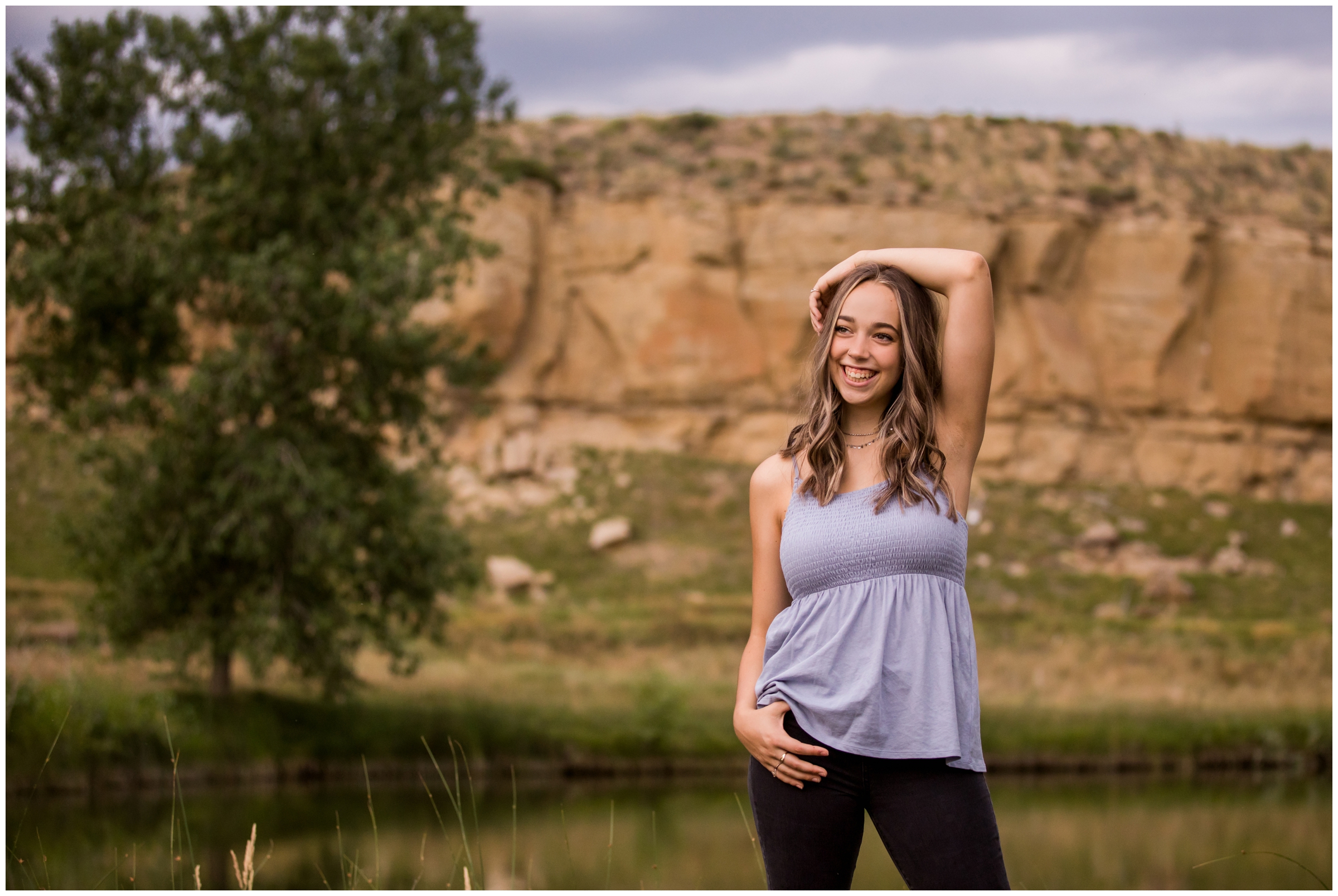 teen girl posing in front of rock formations at Sandstone Ranch Longmont senior photos 