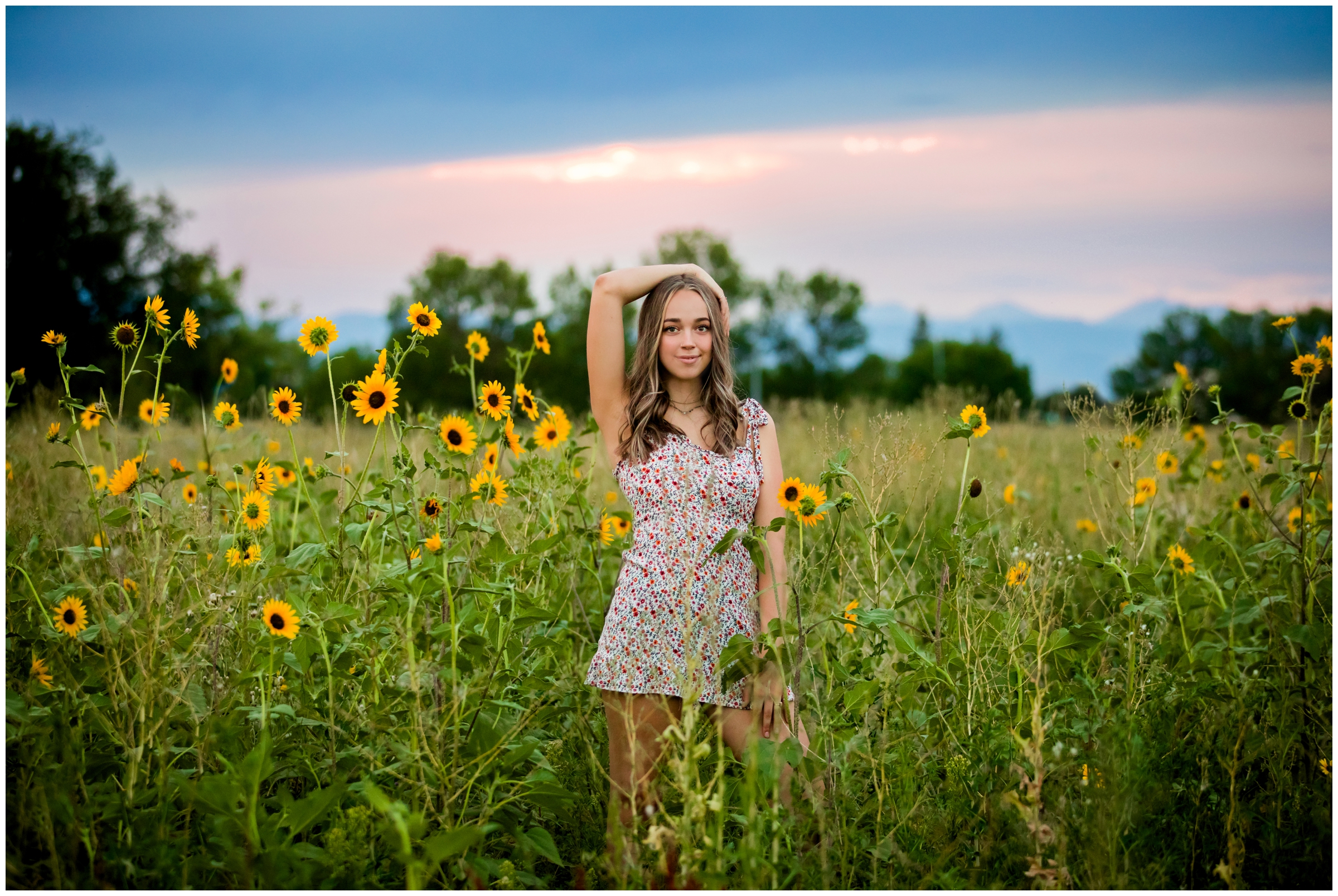 teen posing in sunflower field at sunset during Longmont Colorado senior photography session 