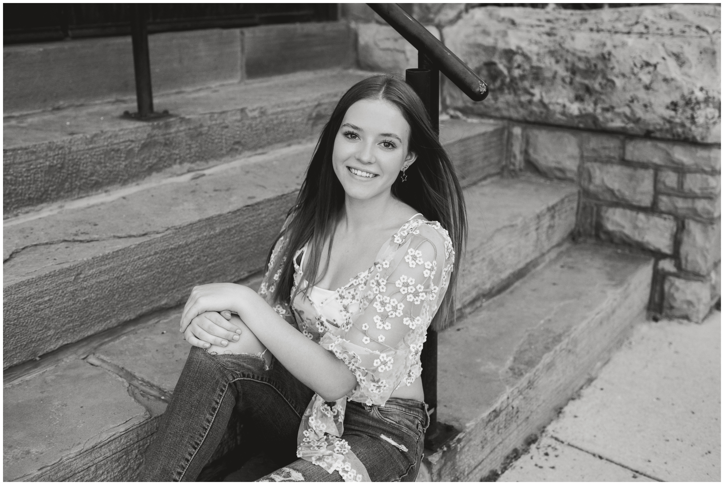 teen girl posing on stairs during Colorado urban senior portraits