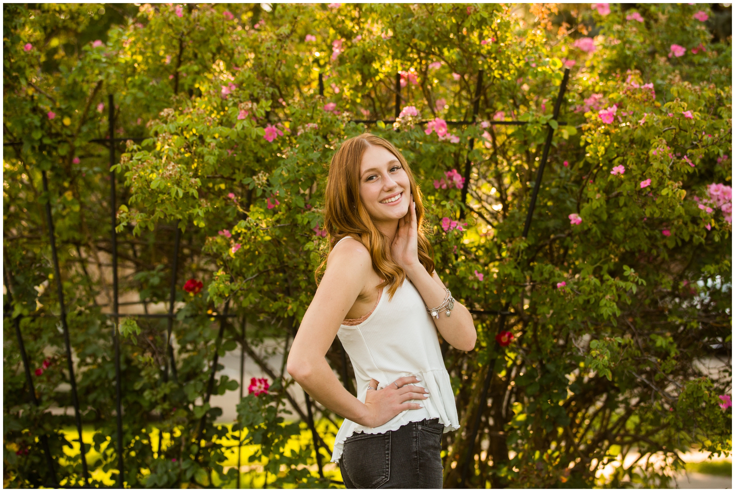 teen girl posing in rose garden during Longmont senior portraits