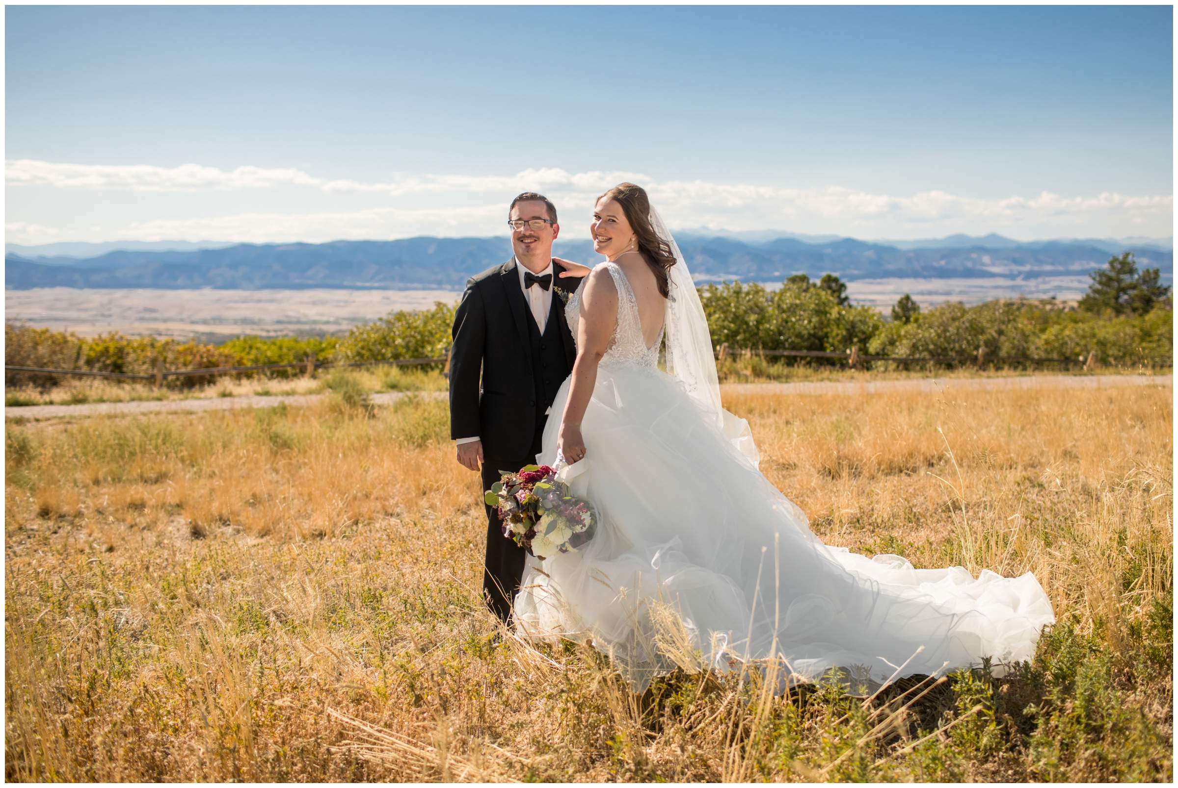 couple posing in golden field at Daniels Park Colorado wedding 