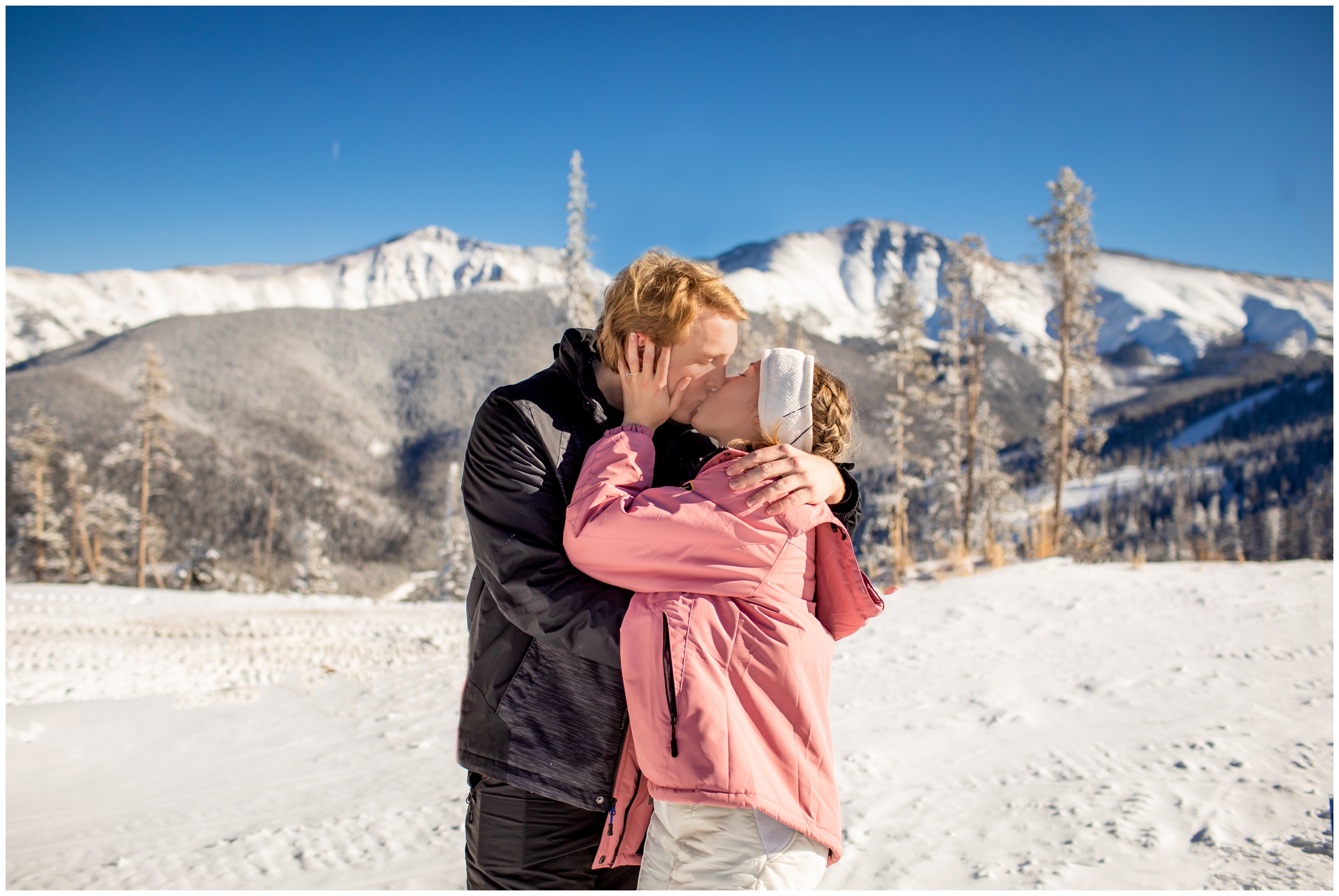 couple kissing after Colorado ski proposal at Winter Park resort 