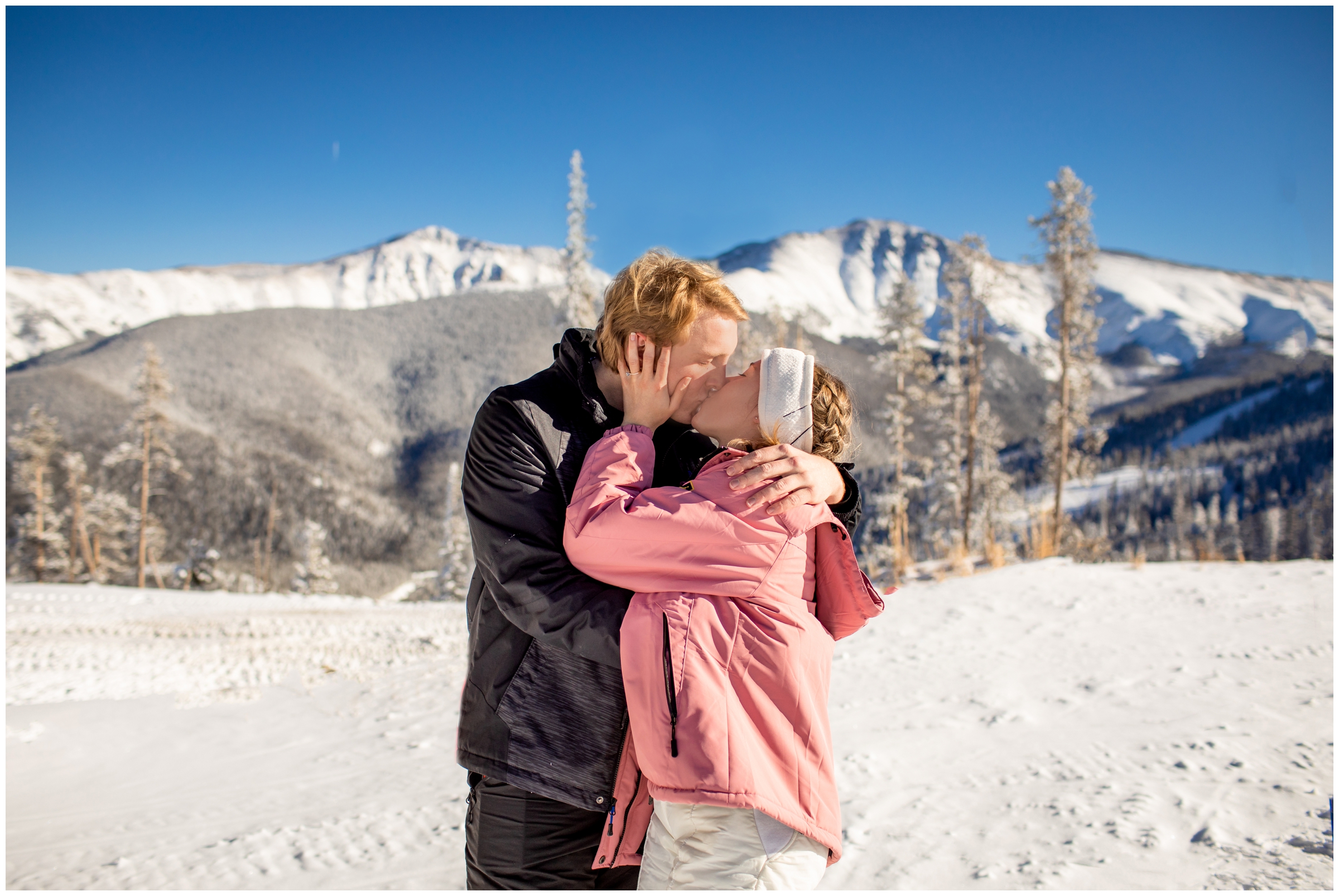 couple kissing after Colorado ski proposal at Winter Park resort