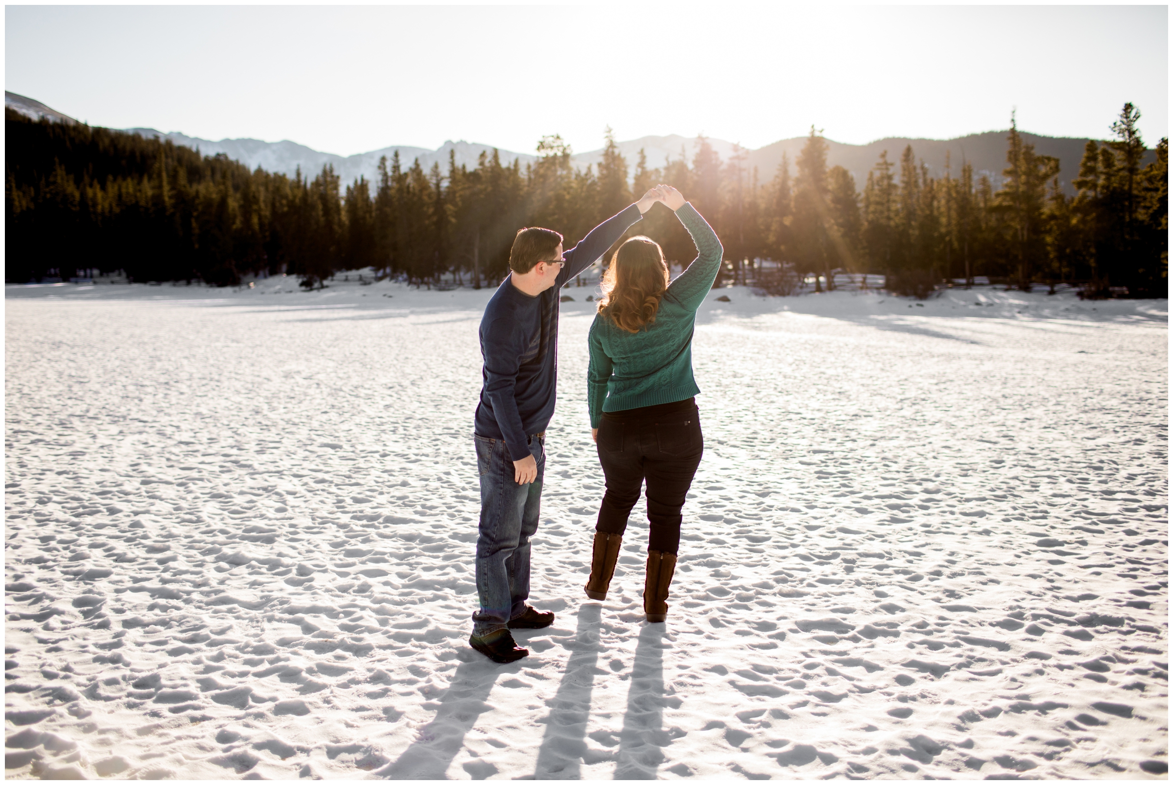 couple dancing on frozen lake during Idaho Springs Colorado portrait photography session