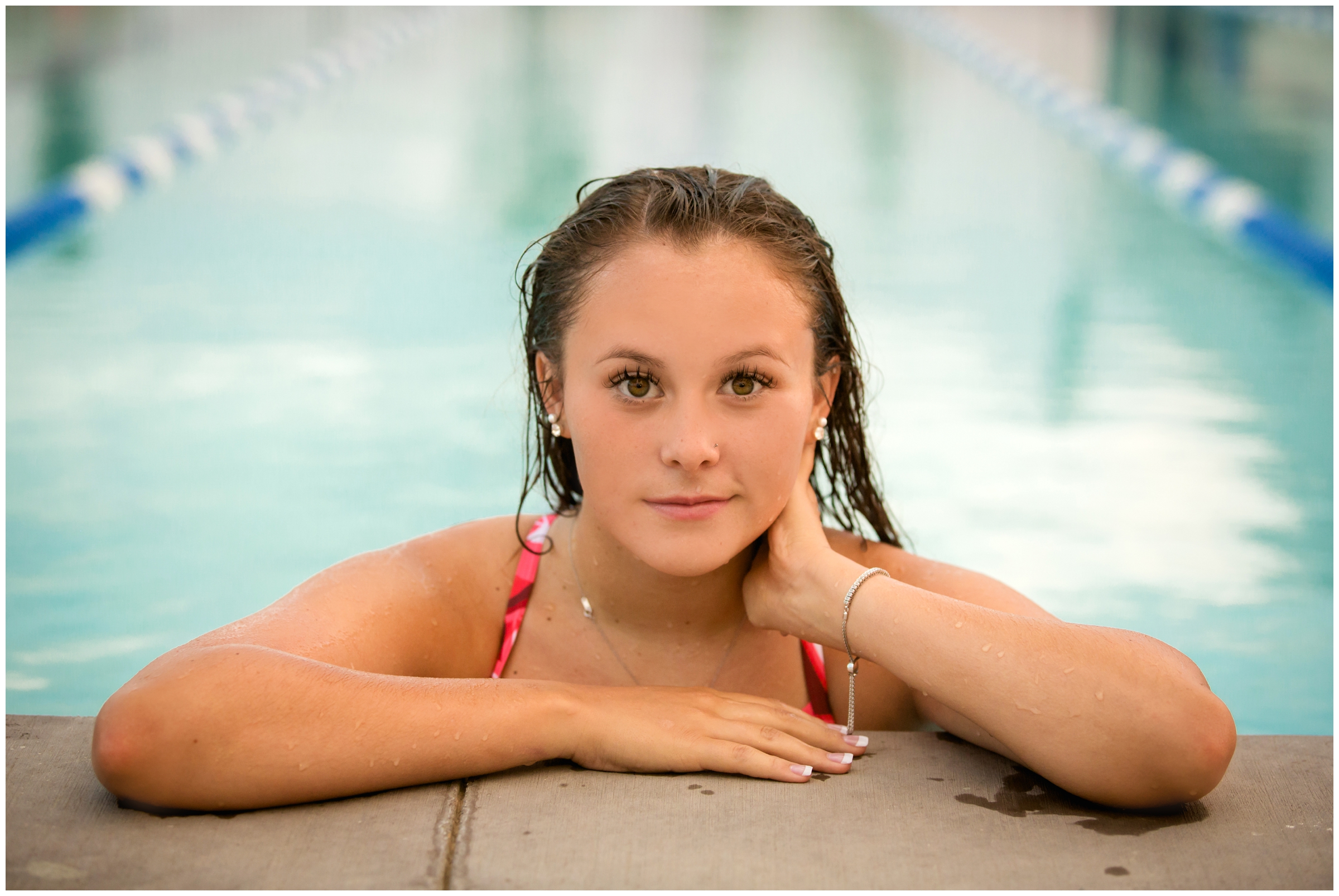 unique senior pictures in a swimming pool in Colorado 