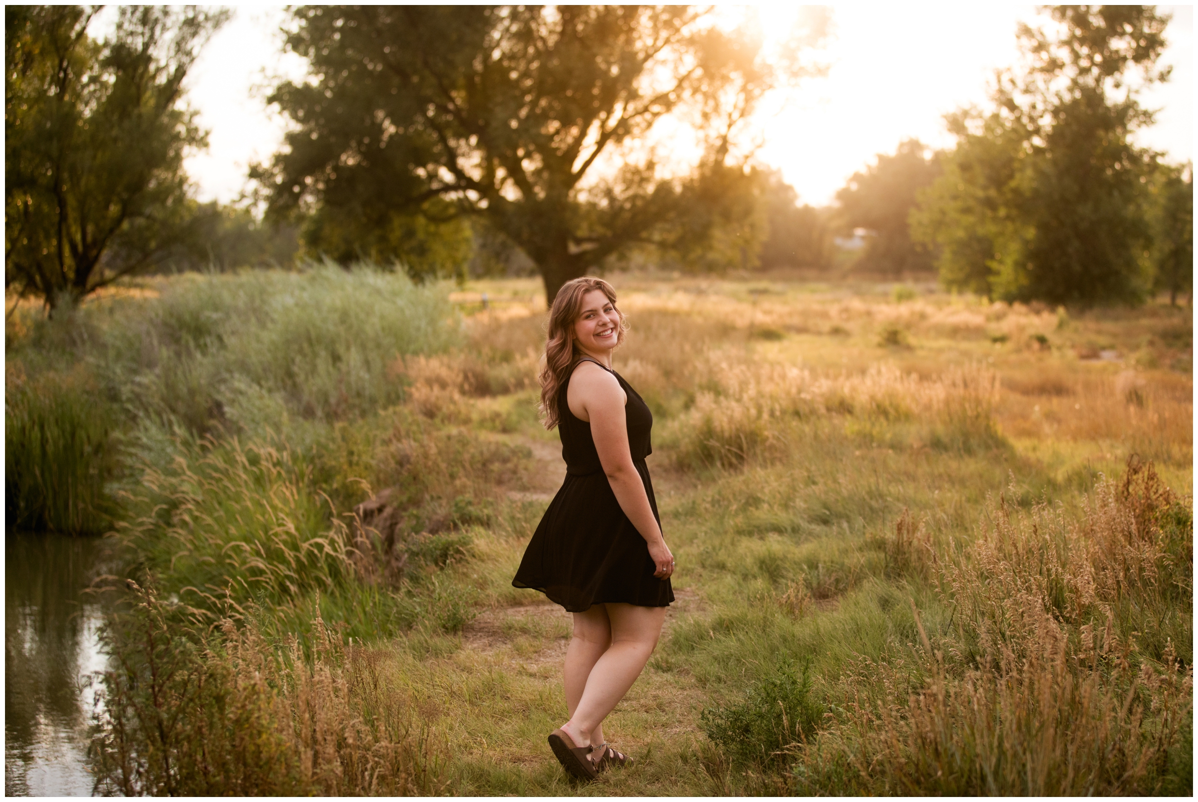 teen twirling in a field during Colorado senior pictures 
