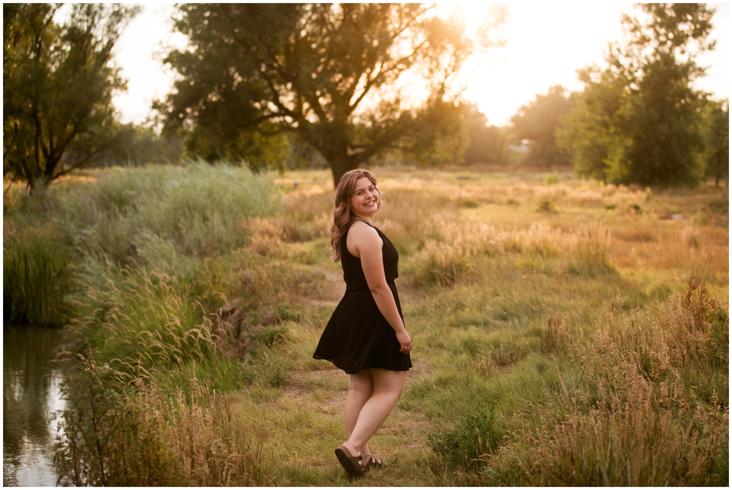 teen twirling in a field during Colorado senior pictures