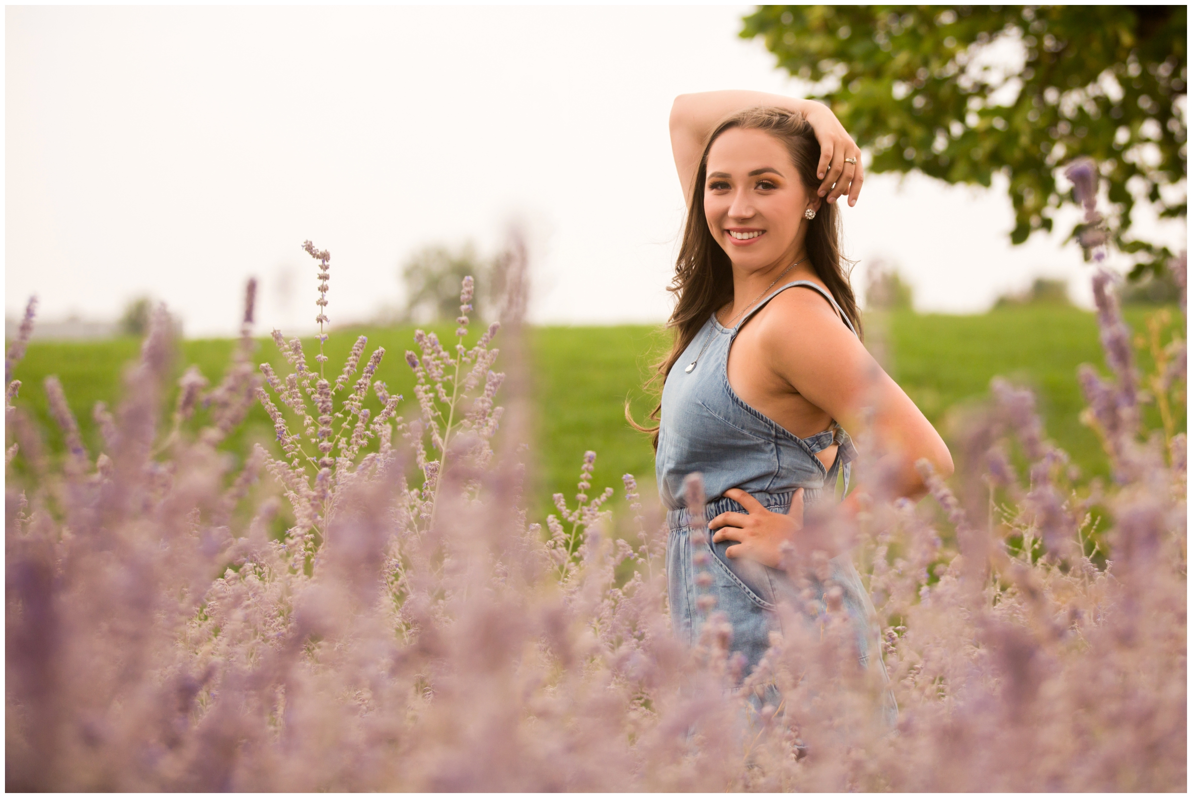teen girl posing in lavender flower field during Colorado senior pictures 