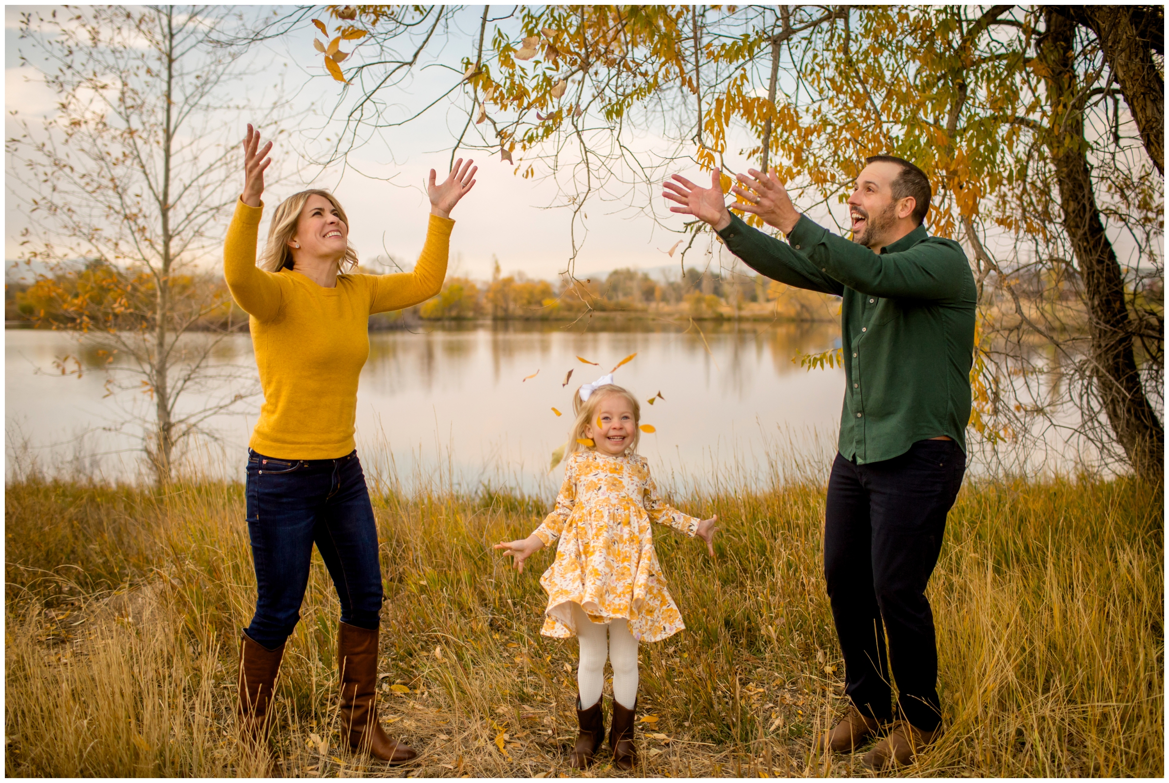 family throwing leaves in air during Colorado fall family photos at Golden Ponds Longmont 